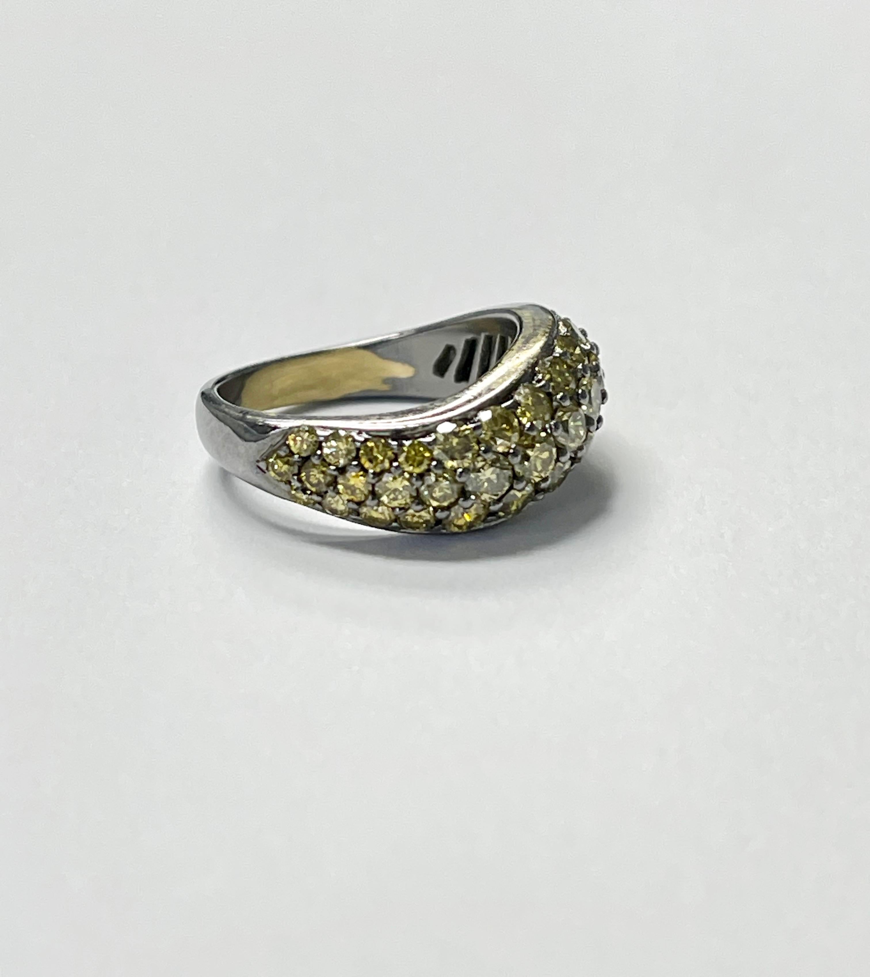 2.40 carat Yellow diamond band ring handmade in 18K blackened or oxidized gold. 
The details are as follows :
Yellow diamond weight : 2.40 carat 
Metal : 18k blackened gold
Ring size : 6 1/2 