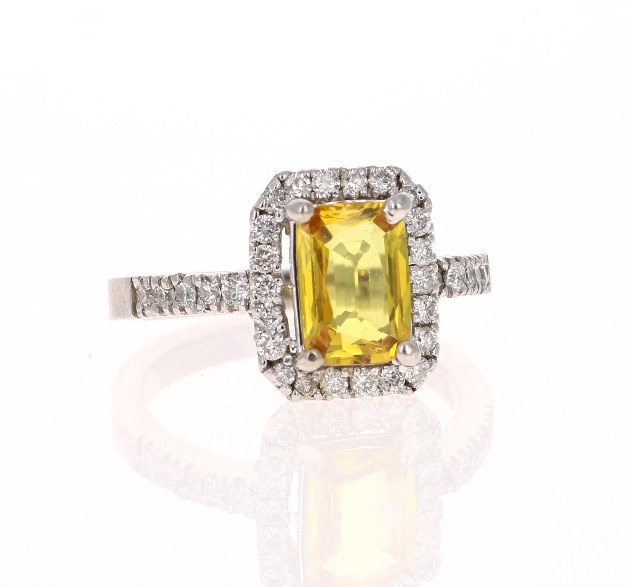 Classic Yellow Sapphire Halo Diamond Ring! 

This beautiful ring has a Emerald Cut Yellow Sapphire that weighs 1.81 Carats. It has a Halo of 34 Round Cut Diamonds that weigh 0.59 Carats. (Clarity: SI, Color: F)

The ring is beautifully set in 14K