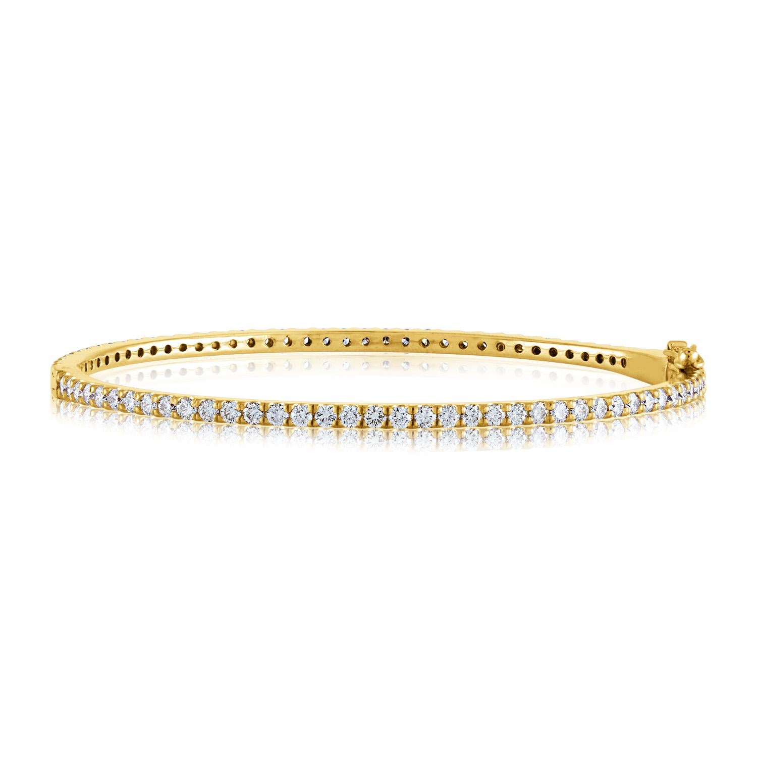 All around Diamond Gold Bangle Bracelet
The bracelet is 14K Rose Gold or Yellow Gold
There is 2.40 Carats in Diamonds F/G VS/SI
Fits up to 6.50 inch wrist.
The bracelet weighs 9.9 grams
Available in rose gold  or yellow gold
Please specify Gold