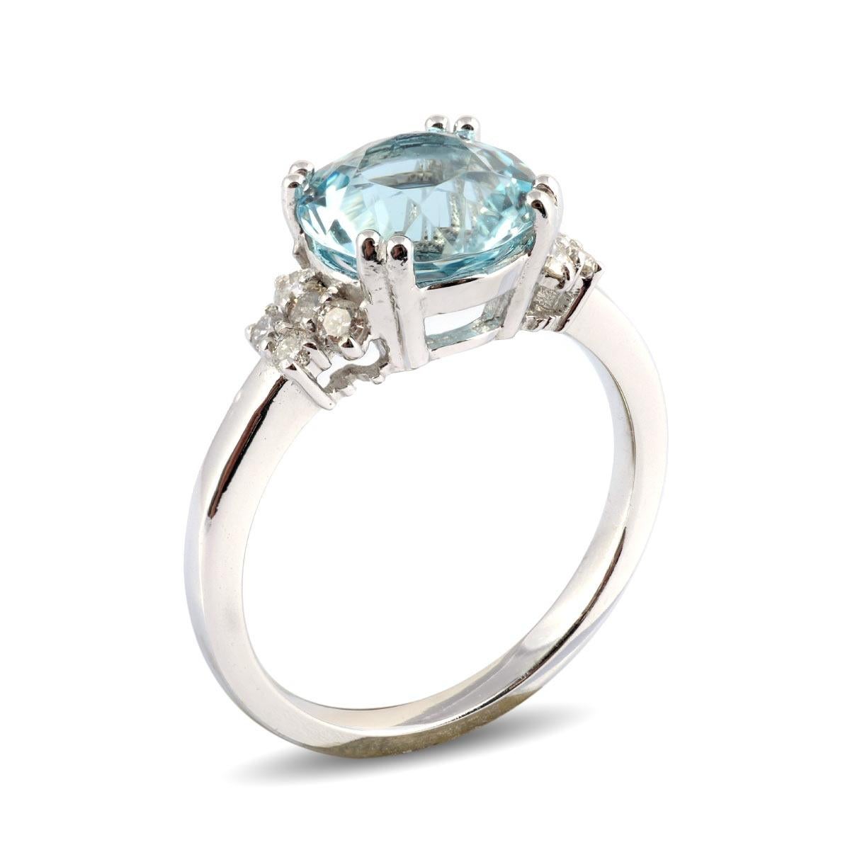 This exquisite ring showcases a round-cut, eye-clean Aquamarine weighing 2.40 carats, renowned for its cool and soothing blue tones. Its versatility makes it a perfect choice to add a pop of color to any white ensemble. The elegant design of the