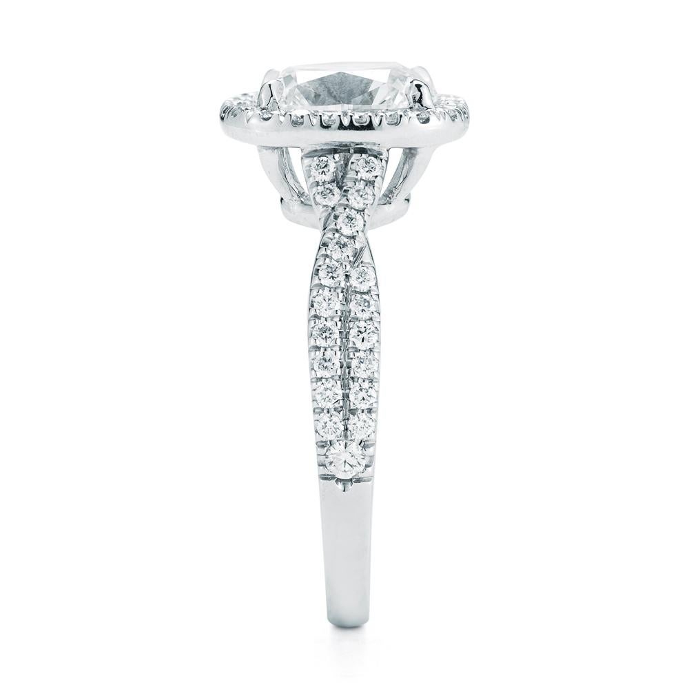 This stunning 2.40 ct. FSI1 GIA Certified Cushion Cut is set in micro-pave halo with 60 diamonds weighing .38 total weight in Platinum. If you don't see something, Say something! We would be happy to work with you to create your dream ring!