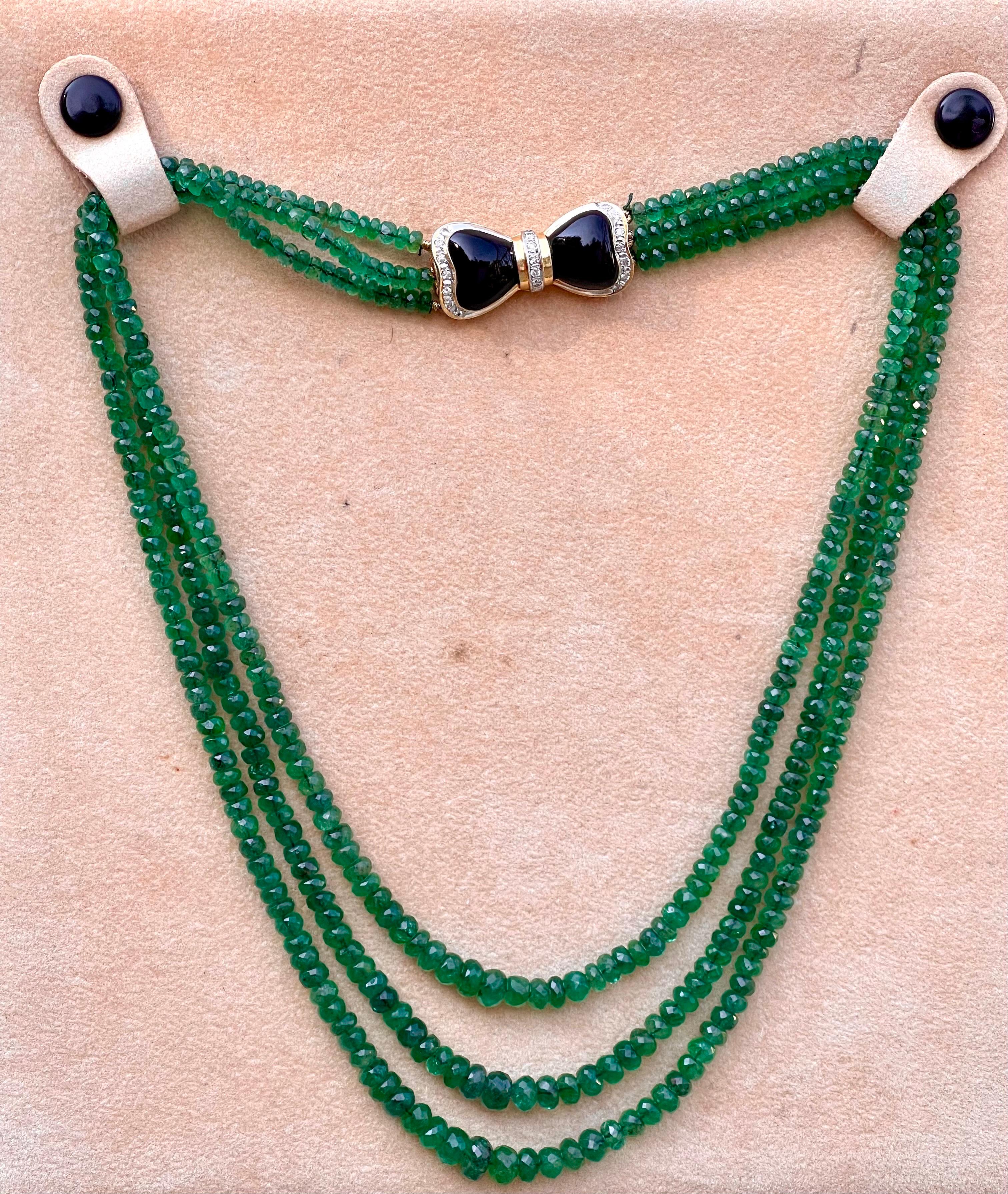 Approximately 240 Ct Fine Natural Emerald Beads 3 Line Necklace with Black Onyx and Diamond  14 Karat Yellow Gold   Clasp
This spectacular Necklace   consisting of approximately 240 Ct  of fine beads.
The shine sparkle and brilliance with deep green