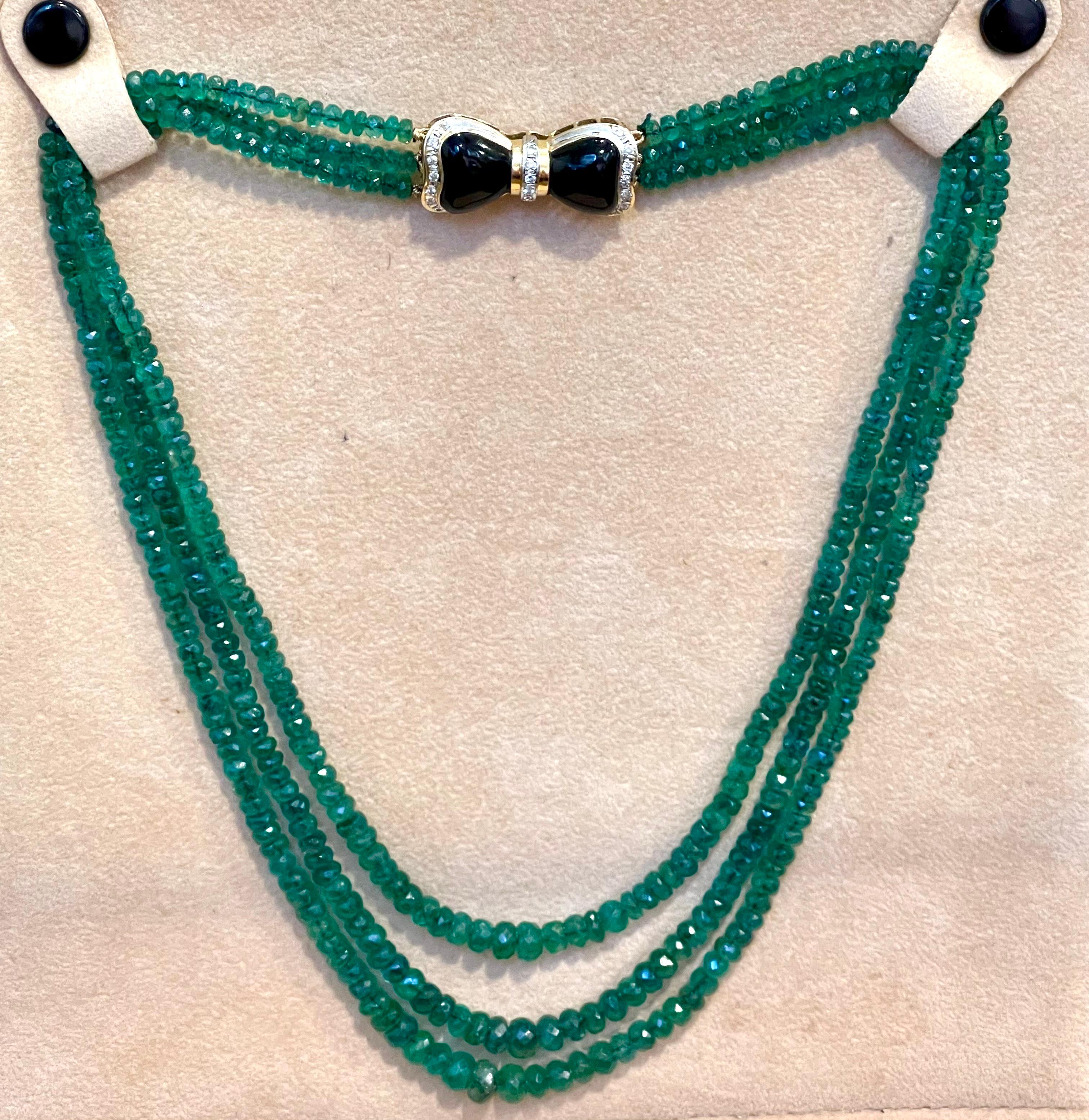 240 Ct Fine Natural Emerald Beads 3 Line Necklace with Black Onyx 14 Kt G Clasp In Excellent Condition In New York, NY