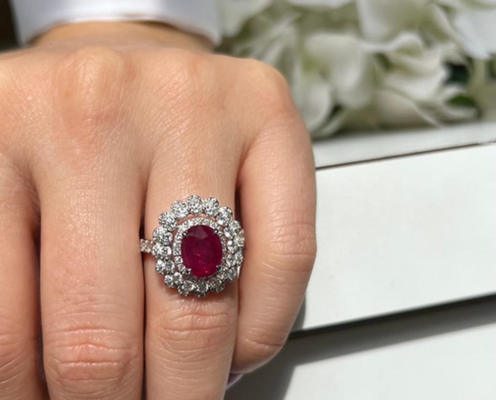 Ruby Weight: 2.40 CTS, Measurements: 9 x 7 mm, Diamond Weight: 1.26 CTS, Metal: 18K White Gold, Ring Size: 6.5, Shape: Oval, Color: Red, Hardness: 9, Birthstone: July