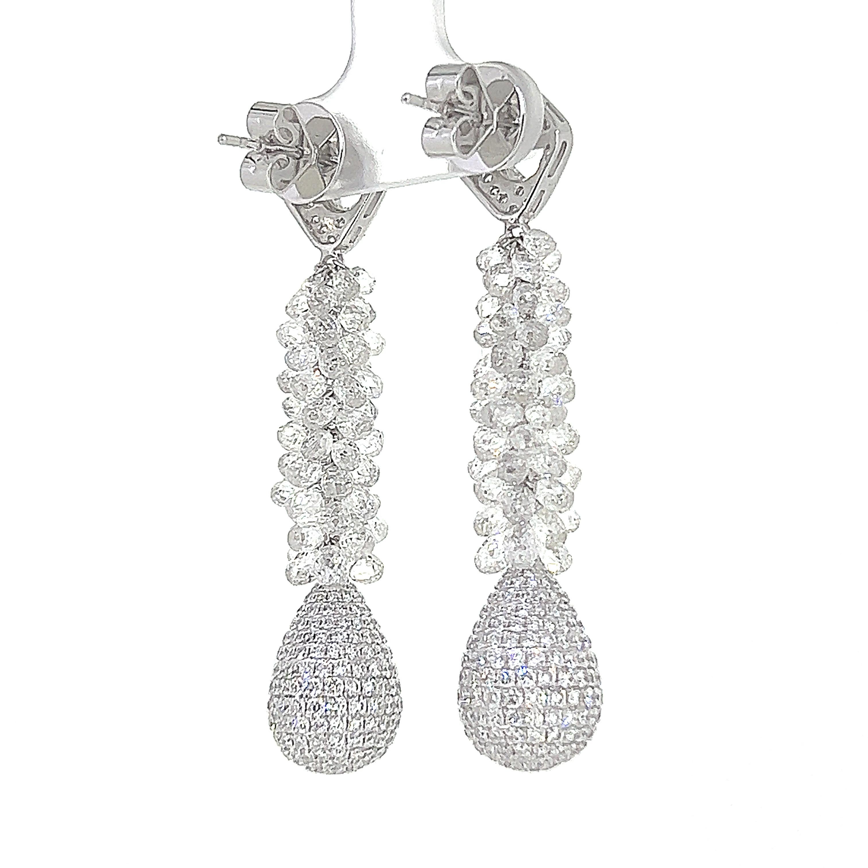 This is an eye-catching and elegant dangling earrings of exceptional quality weighing 24.00 carats in total.  This stunning 1920 inspired pair features 673 pieces of Briolette cut and Round Brilliant cut diamonds set on 18 Karat White Gold.  The