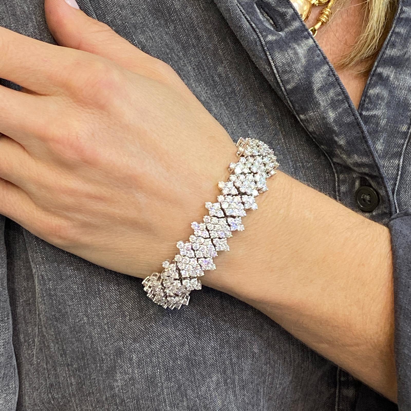 Beautifully crafted diamond bracelet fashioned in platinum. The bracelet features 340 high quality round brilliant cut diamonds weighing 24 carat total weight. The diamonds are graded G-H color and VS clarity. The flexible links with hidden clasp