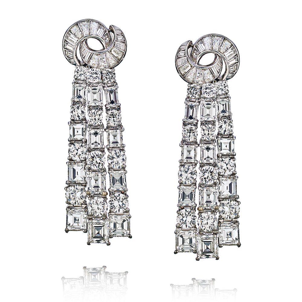 These impressive dangling diamond earrings were made in 1950's and are nothing like you have ever seen before in diamond jewelry. 

They are dramatic yet have a classic shimmer of a straight cut diamond style. Waterfall style is one design that