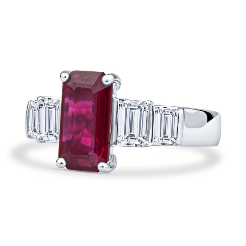 This elegant, sophisticated ring features a 2.40ct, emerald cut, natural Burma ruby (GIA Report #1172411353), with 1.30ct total weight in emerald cut natural diamonds accenting the sides. These stones are set in a platinum ring, which is currently a