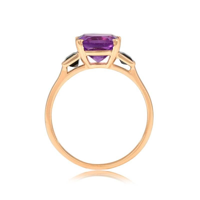 A stunning 18k yellow gold ring featuring a cushion-cut natural purple amethyst weighing around 2.40 carats. Two flanking natural blue baguette-cut sapphires with a combined weight of about 0.50 carats. Handcrafted with a low-profile design.


Ring