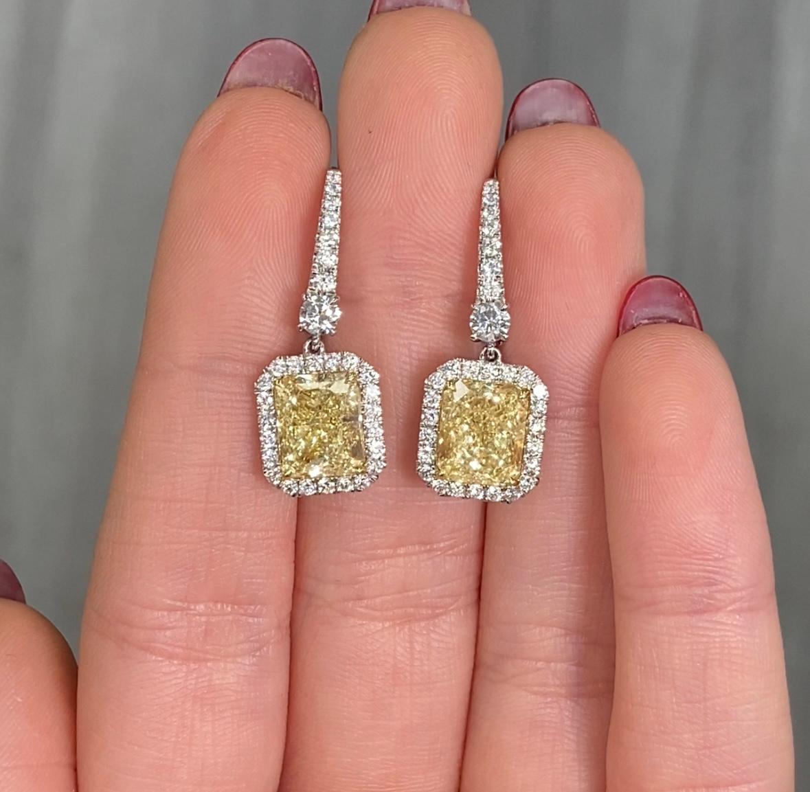 Sensational pair of earrings with an almost 5ct total weight pair of Fancy Light Yellow Radiants with VS clarity
Set in Platinum with 18kt Yellow Gold baskets and 0.40ct of white diamond pave

Making Extraordinary Attainable with Rare Colors
