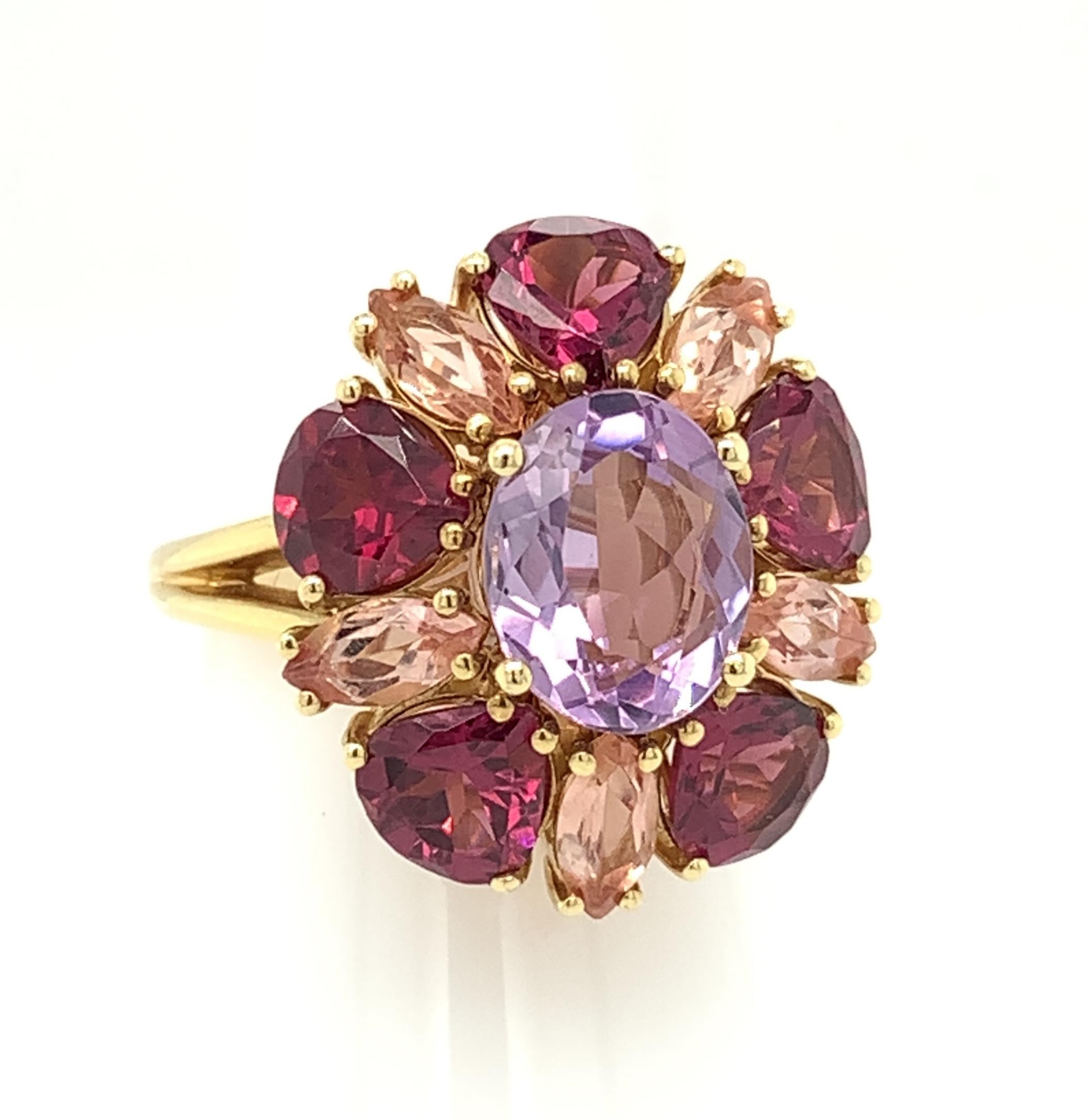 This blooming multicolor ring combines an elegant shade of crystalline amethyst with vibrant rhodolite garnets and coral-colored precious topaz! “Rose de France” is the name given to this particular color of amethyst, making it the perfect center