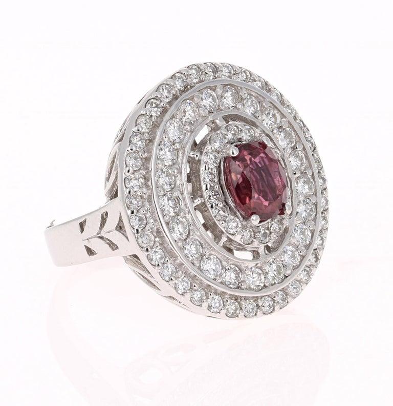 A real statement piece - Ruby and Diamond Cocktail Ring in 14K White Gold
This ring has a gorgeous Burmese Oval Cut Ruby that weighs 1.20 carats in the center and is surrounded by 3 rows of 73 Round Cut Diamonds that weigh 1.21 carats (Clarity: VS2,