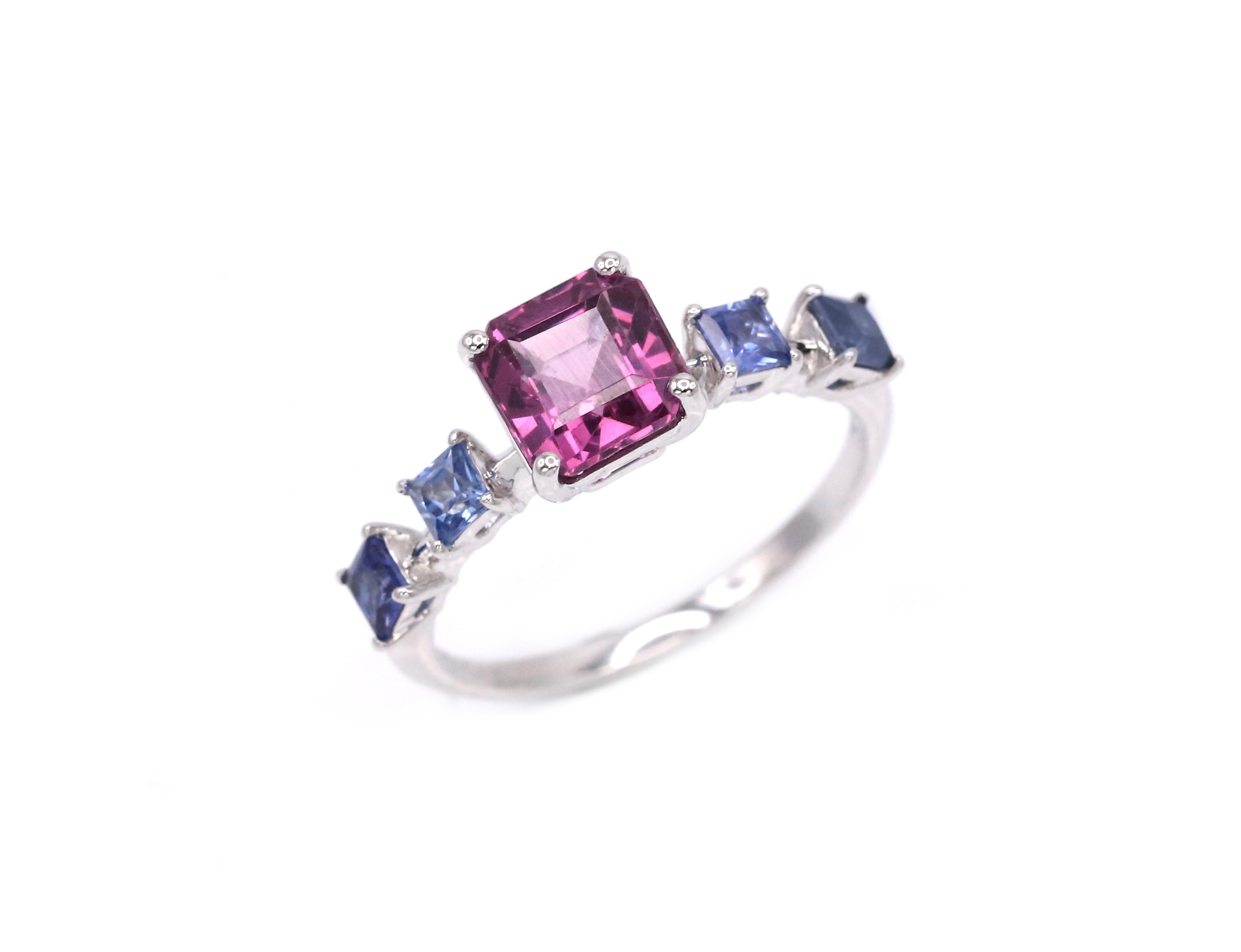 Extremely stylish fashionable 2.41 CTW Garnet Blue Sapphire 18K Gold Cocktail Ring.
It could be perfect for special occasion or for every day use.
The item contains 4 Blue Sapphires of total weight 0.61 ct, 1 Garnet of 1.88 ct, White Gold.

SIZE of