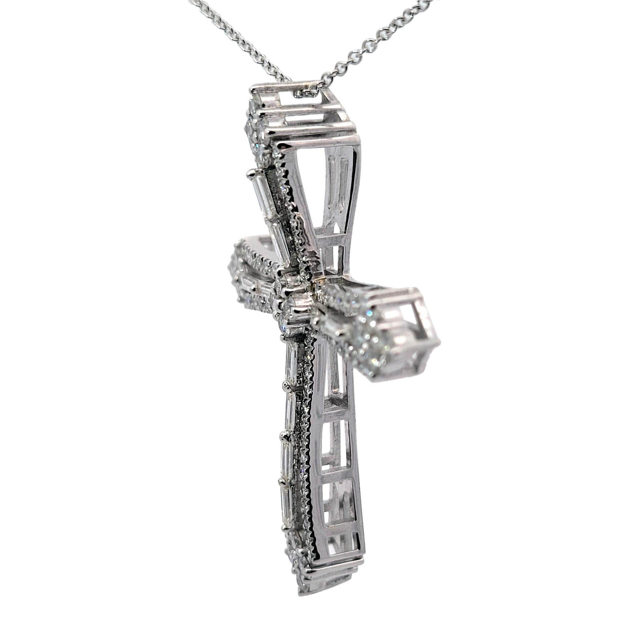 14K Gold Beautiful Cross Pendant with 10 perfectly matched Baguette  and 96 Round Brilliant Diamonds with total weight of 2.42 Ct .
Size 38 mm x 48 mm .
Metal: 14K White Gold 9.9 gr.
Round diamonds: 20x2.3 mm Prong Set, 76 1.35 mm Micro Pave