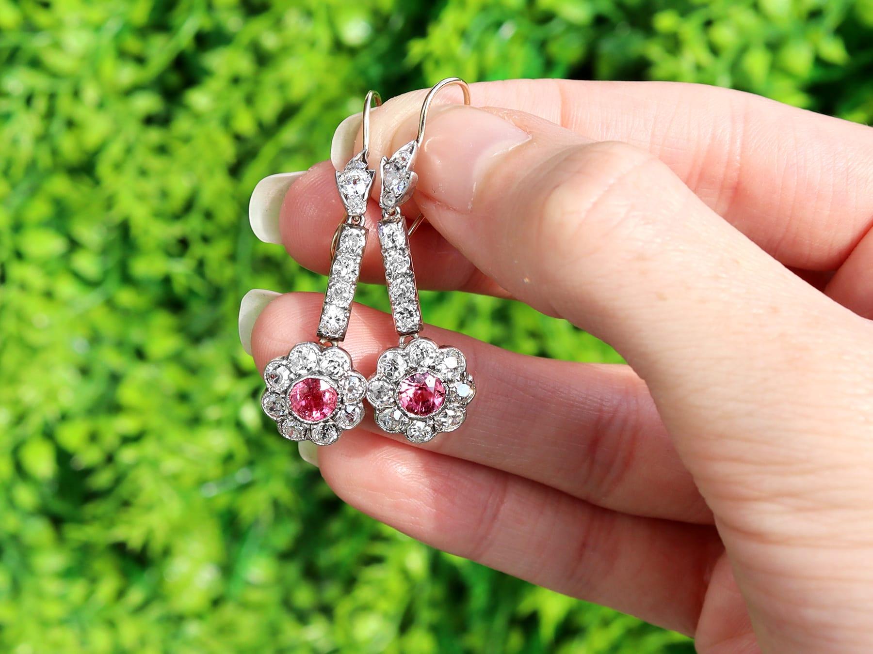 A stunning, fine and impressive pair of antique 1.05 carat natural pink sapphire and 2.42 carat diamond, 12 karat yellow gold, silver set drop earrings; part of our antique jewelry and estate jewelry collections.

These stunning, fine and impressive