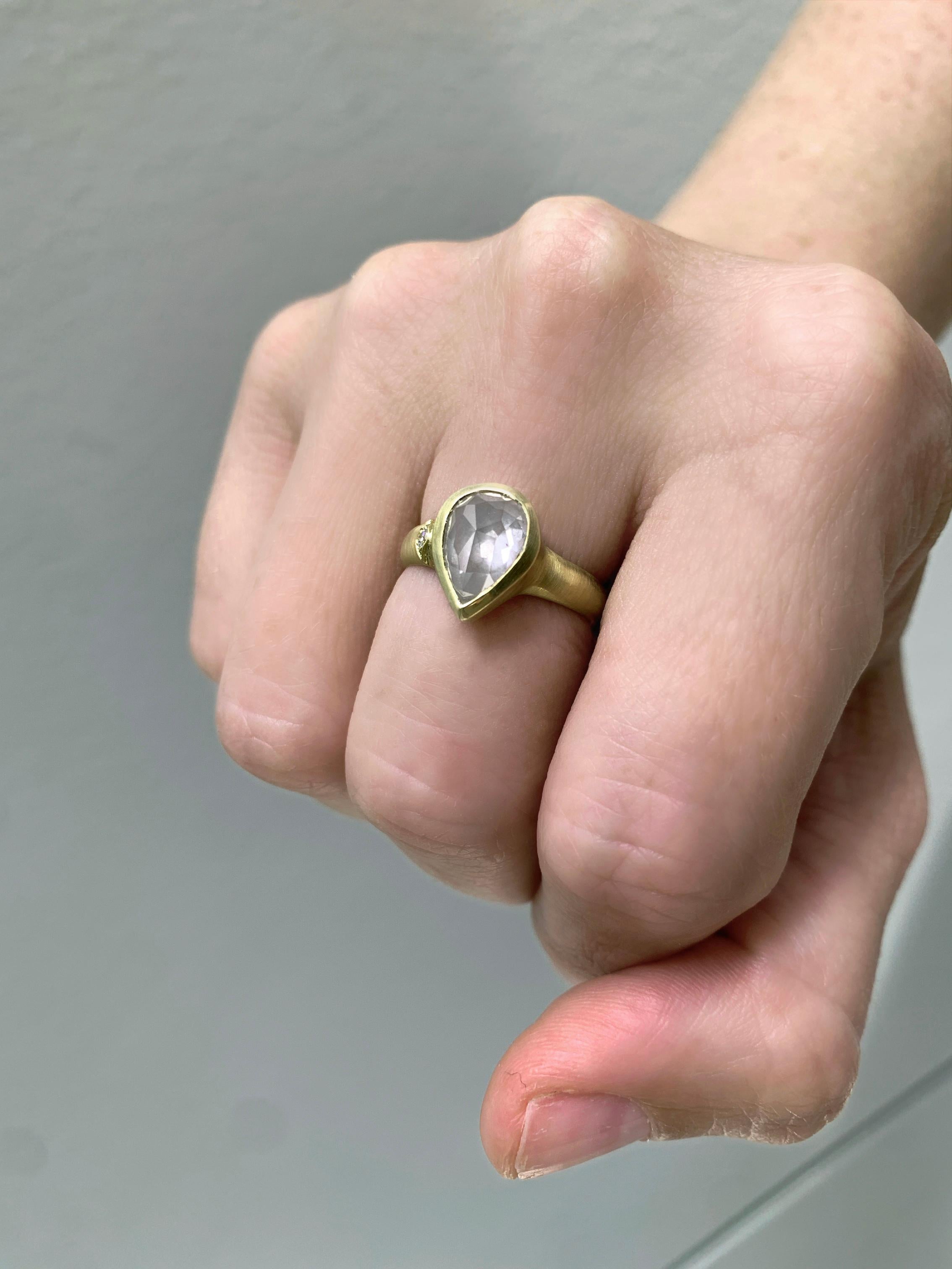 One of a kind ring hand-fabricated by jewelry maker Monica Marcella cast in the artist's signature-finished 18k yellow gold showcasing a gorgeous double-cut pear shaped diamond totaling 2.42 carats with stunning sparkle and a subtle glow,