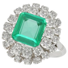 2.42 Carat Emerald 1.62 Carat Diamond White Gold Cluster Ring