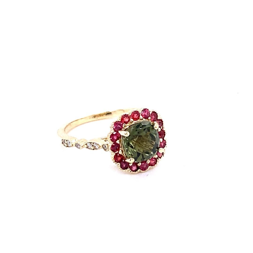 2.42 Carat Tourmaline Sapphire Diamond Yellow Gold Ring

This gorgeous ring has a beautiful Cushion Cut Green Tourmaline weighing 1.81 Carats and is surrounded by a Halo of 18 Round Cut Red Sapphires weighing 0.50 carats.  Along the shank of the