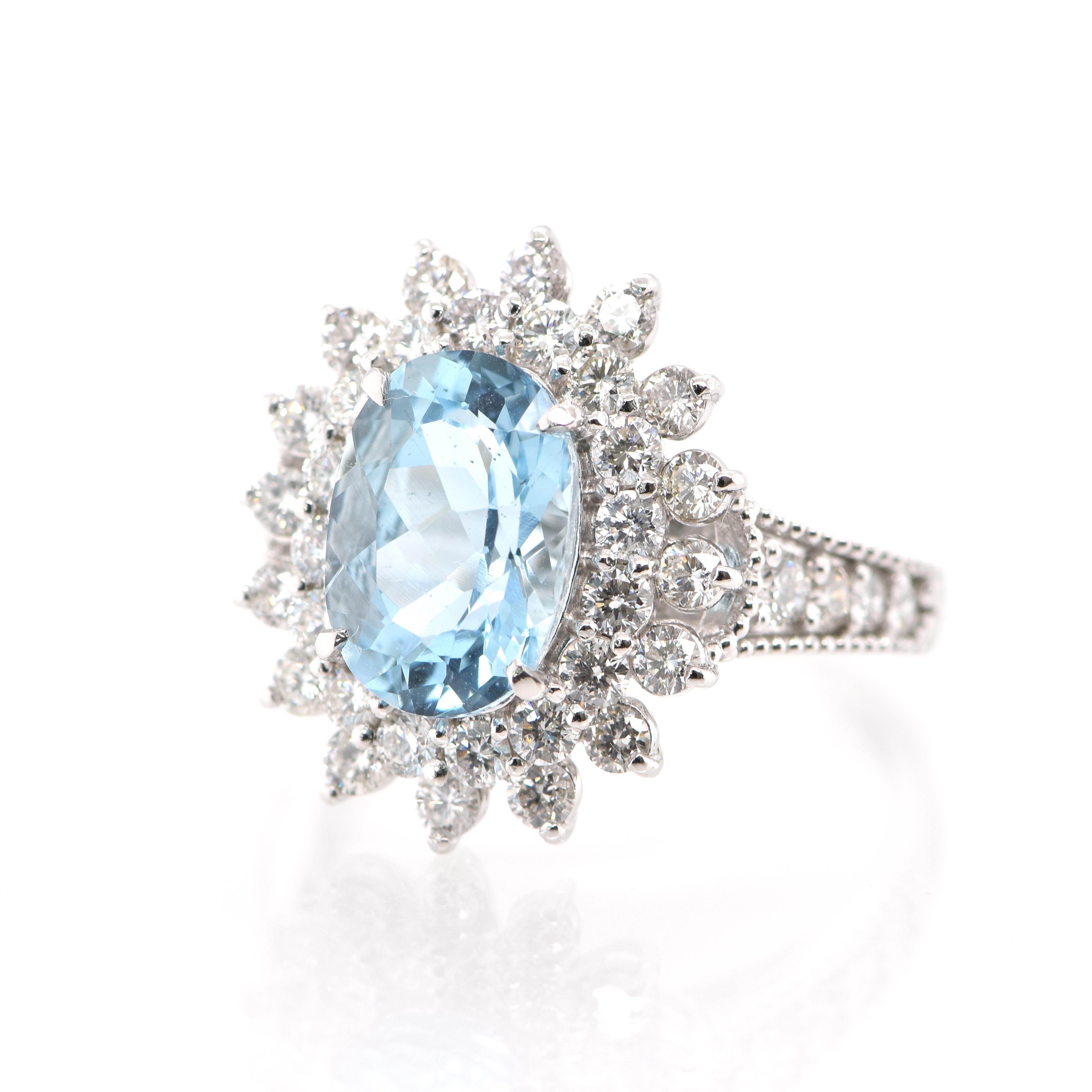 A beautiful Cocktail Ring featuring a 2.42 Carat Natural Aquamarine and 1.18 Carats of White Round Brilliant Diamond Accents set in Platinum. Aquamarines have been prized gems throughout human history for their cool blue color. They historically