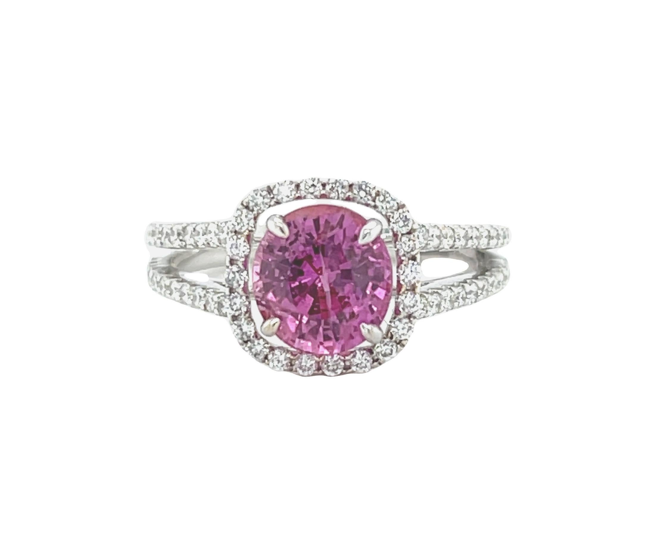 This beautiful 18k white gold ring features an absolutely stunning, 2.42 carat round pink sapphire GEM! Weighing 2.42 carats, the pink sapphire has vivid pure pink color and extraordinary brilliance, making this stone appear full of life from all