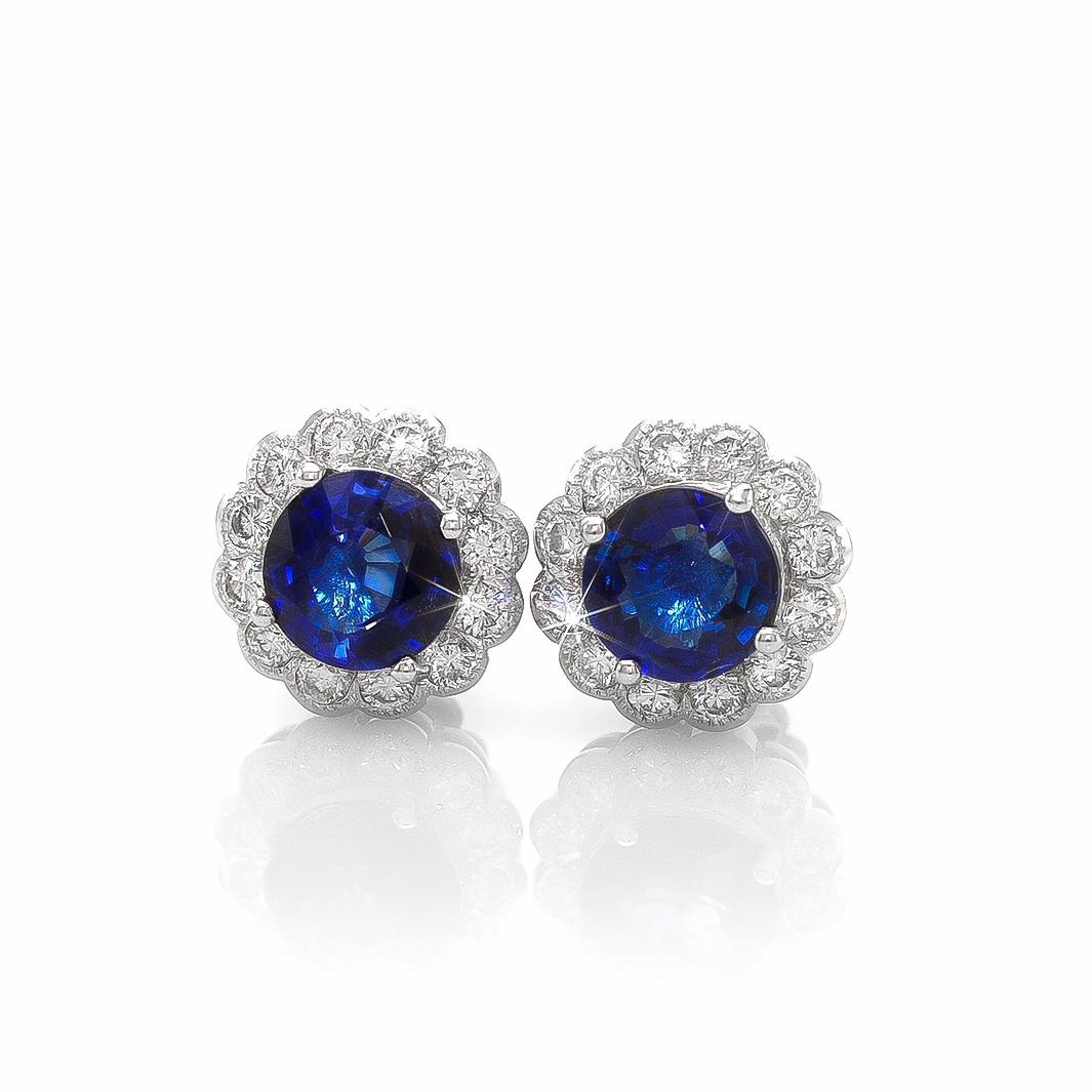 These 'Eyes of the Ocean' rare Blue Sapphire earrings are elegantly placed in a beautifully textured white gold setting. 2.42 carats Rare Blue Sapphire Earrings are brilliantly set with 18K White Gold, creating tremendous contrast between the luster