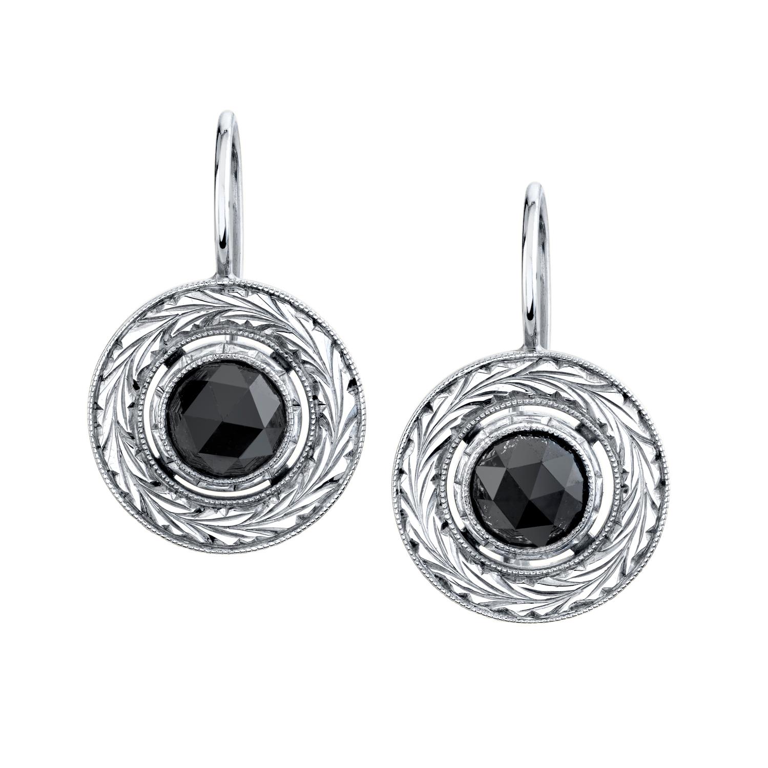 Rough and refined! Black diamonds and white gold are not necessarily a black tie affair! These drop earrings can be worn casually, even though they sport a large, over one carat diamond in each earring for a total weight of 2.42 carats. The diamonds