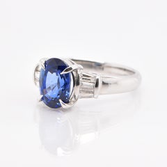 2.43 Carat, Natural Sapphire and Tapered Diamond Ring Set in Platinum