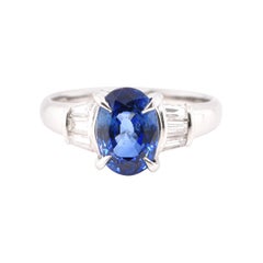 2.43 Carat, Natural Sapphire and Tapered Diamond Ring Set in Platinum