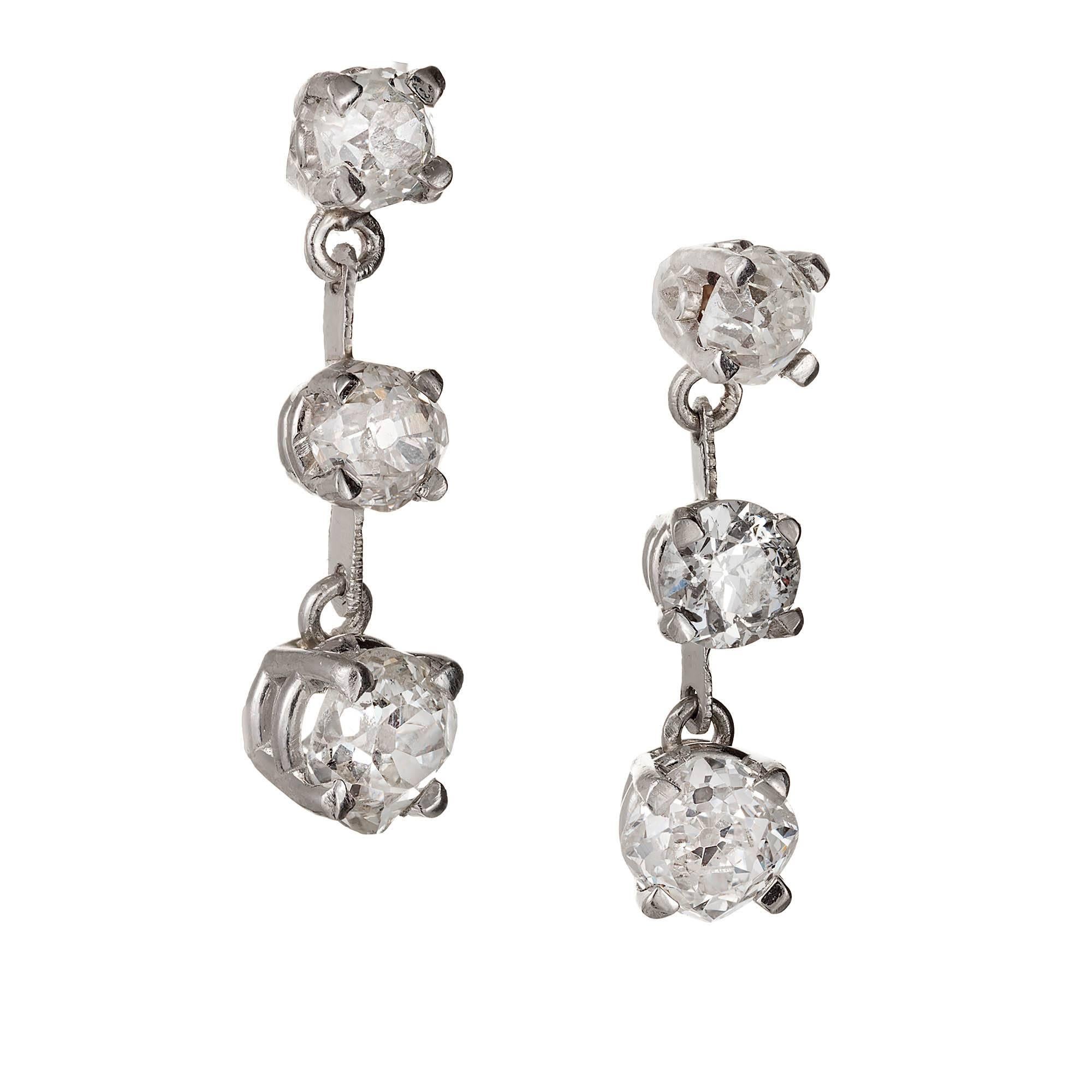 1900's Handmade three section old mine diamond dangle earrings. Made in solid Platinum with simple bar style and very thin dangle sections. Set with bright and shiny old mine cut diamonds. Complete with very raised crowns, small tables, open culets.