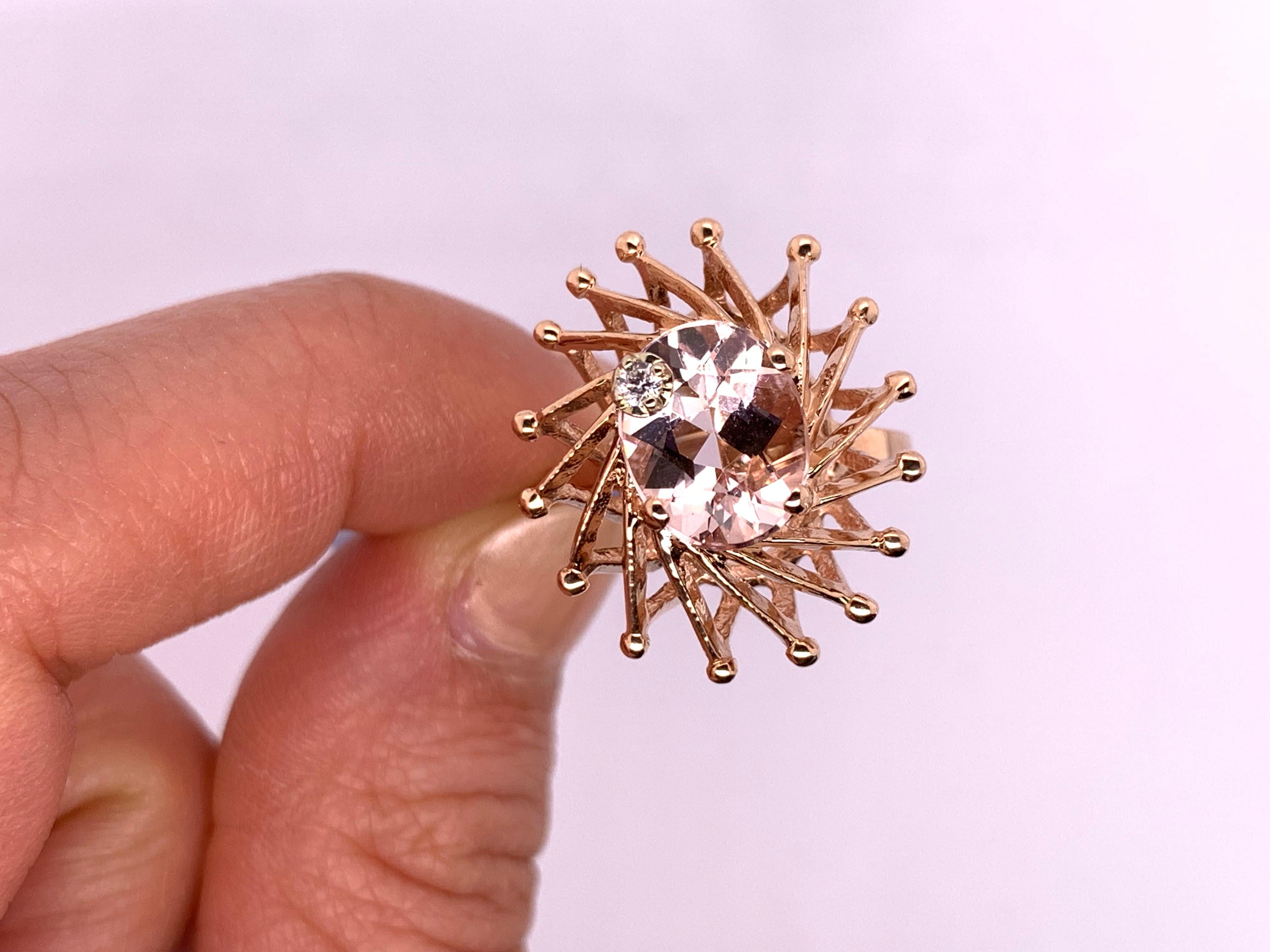Material: 14k Rose Gold 
Center Stone Details: 1 Oval Pink Morganite at 2.43 Carats- Measuring 10 x 8 mm
Mounting Diamond Details: 1 Round White Diamond at 0.02 Carats - Clarity: SI / Color: H-I
Ring Size: Size 6 (can be sized)

Fine one-of-a kind