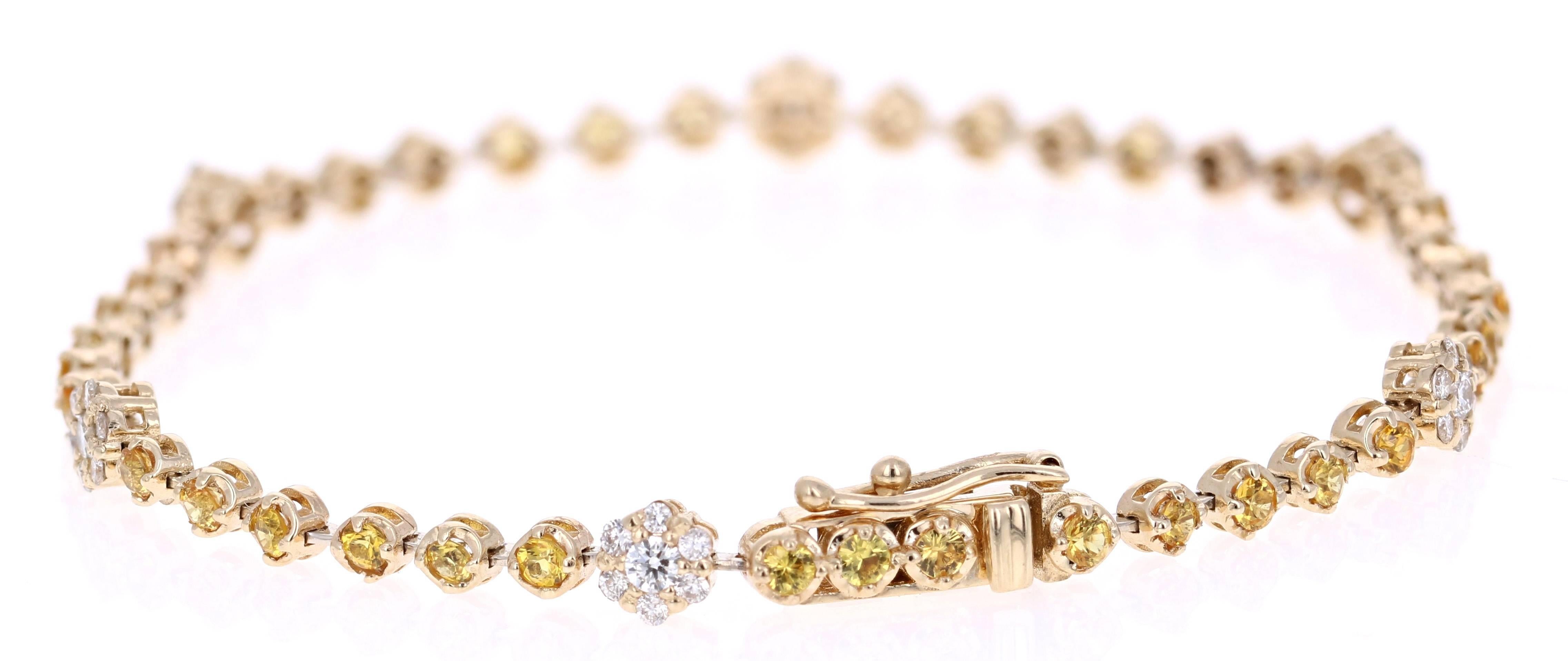 Dainty, Delicate, and Beautiful. 
A 14K White Gold Yellow Sapphire and Diamond Bracelet with a flower design. 

The 36 Round Cut Yellow Sapphires are 1.77 carats and the 42 Round Cut Diamonds are 0.66 carats, with a total carat weight of 2.43