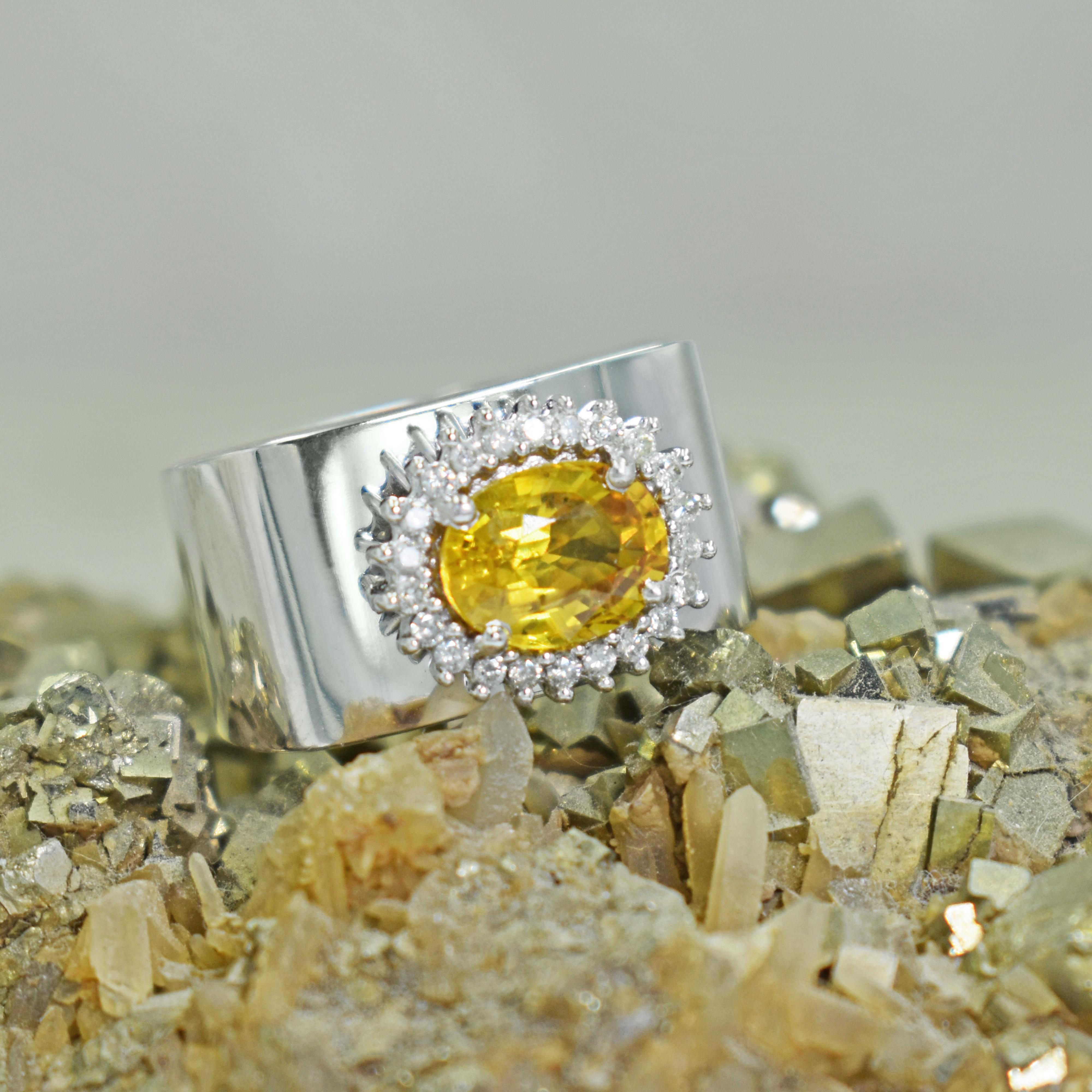 2.43 carat faceted oval yellow Sapphire and diamond halo (0.19 ctw, G-H, I1) in this solid 14k white gold alternative engagement or cocktail ring. Ring is currently sized US 7 and can be resized. The horizontal golden Sapphire and diamond halo in