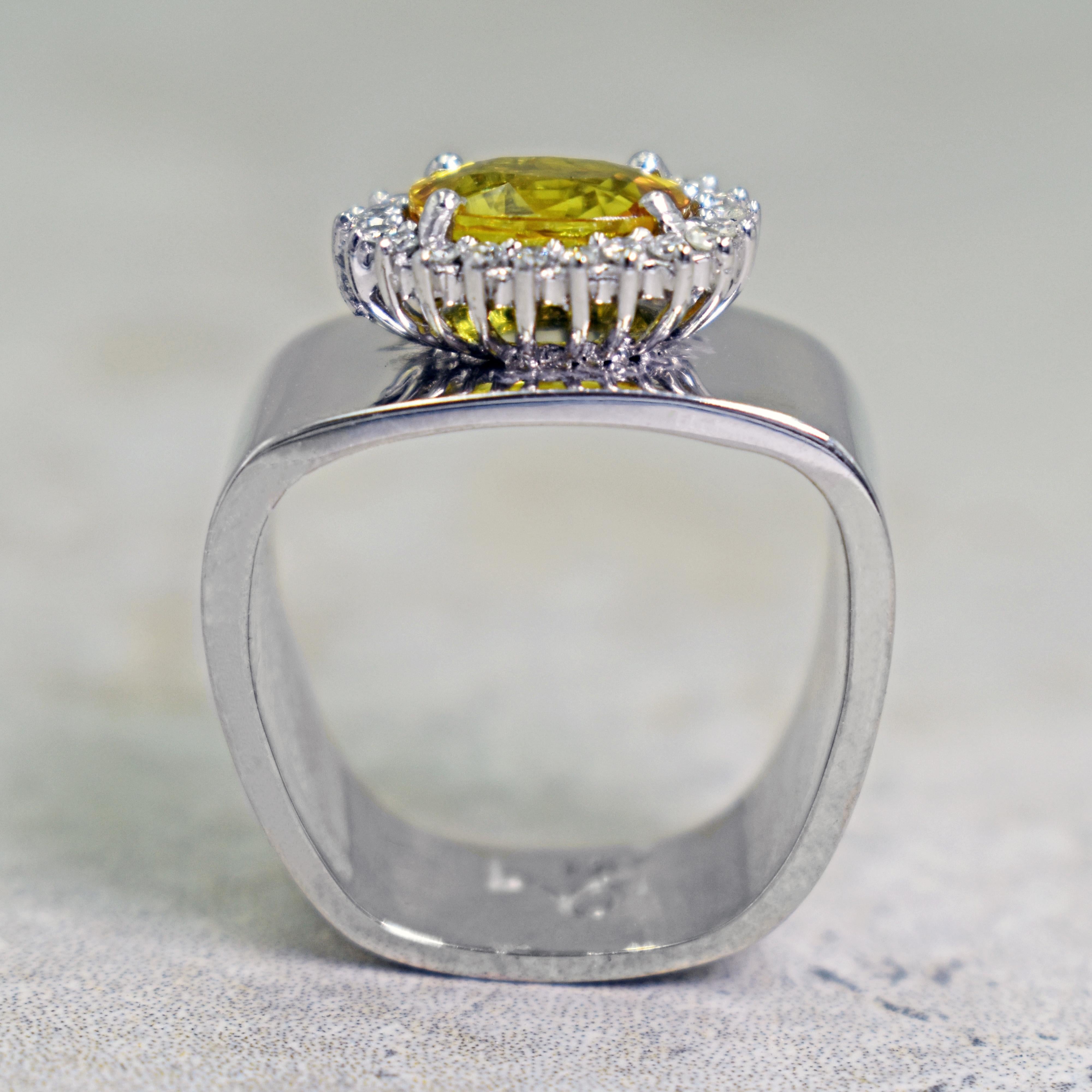 Contemporary 2.43 Carat Yellow Sapphire Diamond Halo 14 Karat White Gold Cocktail Ring For Sale