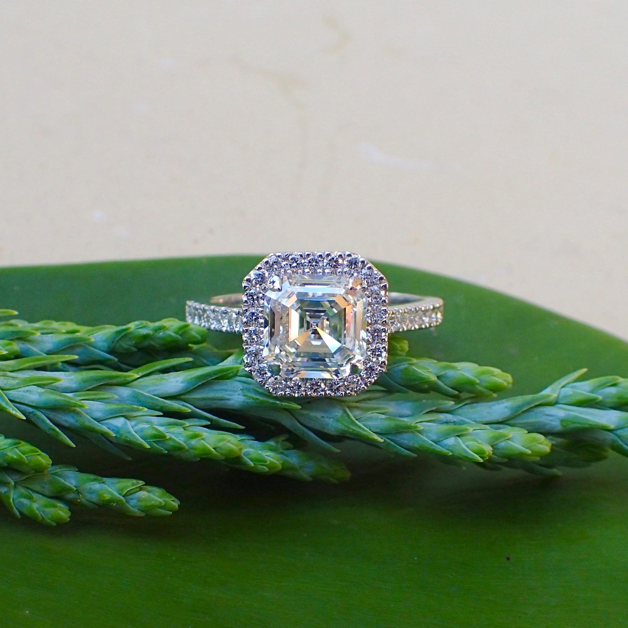 One (1) 18k white gold engagement ring contains one (1) Square Emerald Cut diamond that weighs 2.01 carats that measures 7.18 x 7.17 x 4.38mm with Clarity Grade SI1 with Color Grade G with Very Good Polish with Excellent Symmetry (see GIA Report