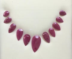243.08 Carats Ruby Mozambique Pear Faceted Cut stone Layout Heated Natural Gem