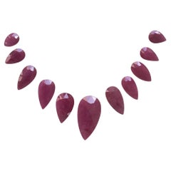 243.08 Carats Ruby Mozambique Pear Faceted Cut stone Layout Heated Natural Gem