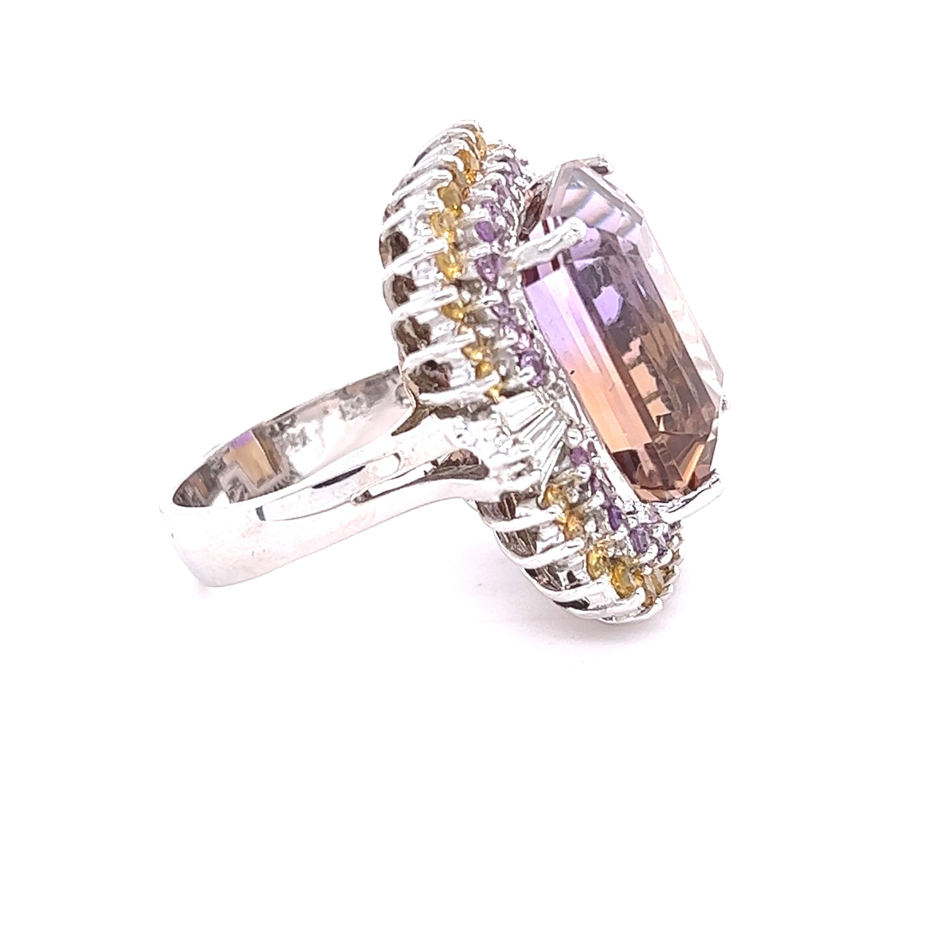 This ring has a 22.58 carat Emerald Cut Ametrine (Ametrines are a mix of amethyst and citrine yielding one natural stone) and has 6 Baguette Cut Diamonds that weigh 0.42 carats. (Clarity: SI2 Color: F)  The total weight of the ring is 24.33 carats.