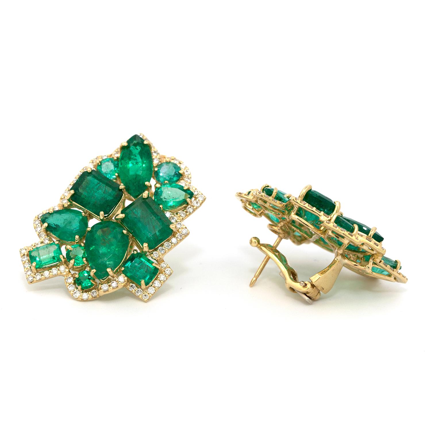 22 mixed shaped vintage emeralds that weigh 24.38 cts. that are set in a modern  18k yellow gold French clip earring that are outlined with 147 micro pave’ set diamonds, weighing 1.92 cts. that strengthen the geometric symmetry created by the multi