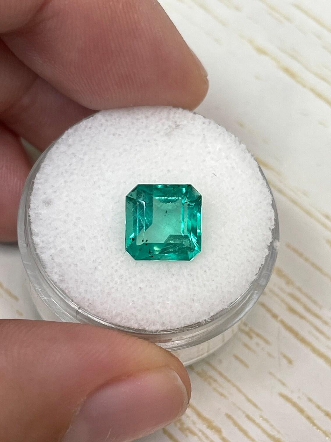 Stone: Emerald
Weight: 2.44-carats
Shape: Asscher Cut
Clarity: Transparent
Luster: Very Good
Color: Bluish Green
Measurements: 8.43mm x 8.41mm x 5.25mm
Geographic Origin: Colombia
Treatment: Natural, Oiling

Comments: Due to their growth conditions