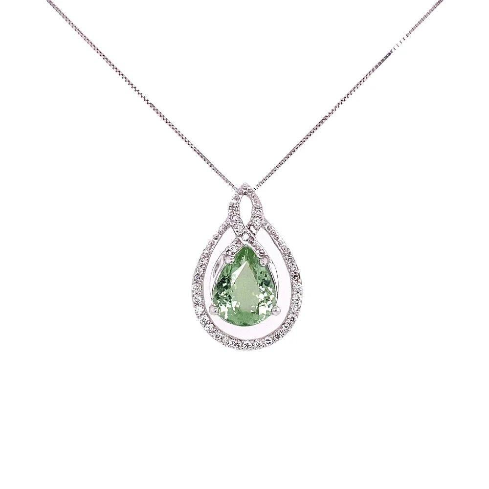 Simply Beautiful! Paraiba Tourmaline and Diamond Gold Drop Pendant Necklace. Centering a securely nestled Hand set 2.44 Carat Pear shape Paraiba Tourmaline GIA #s 1216947265 and 6224825155. Surrounded by Diamonds approx. 0.26tcw. Pendant dimensions: