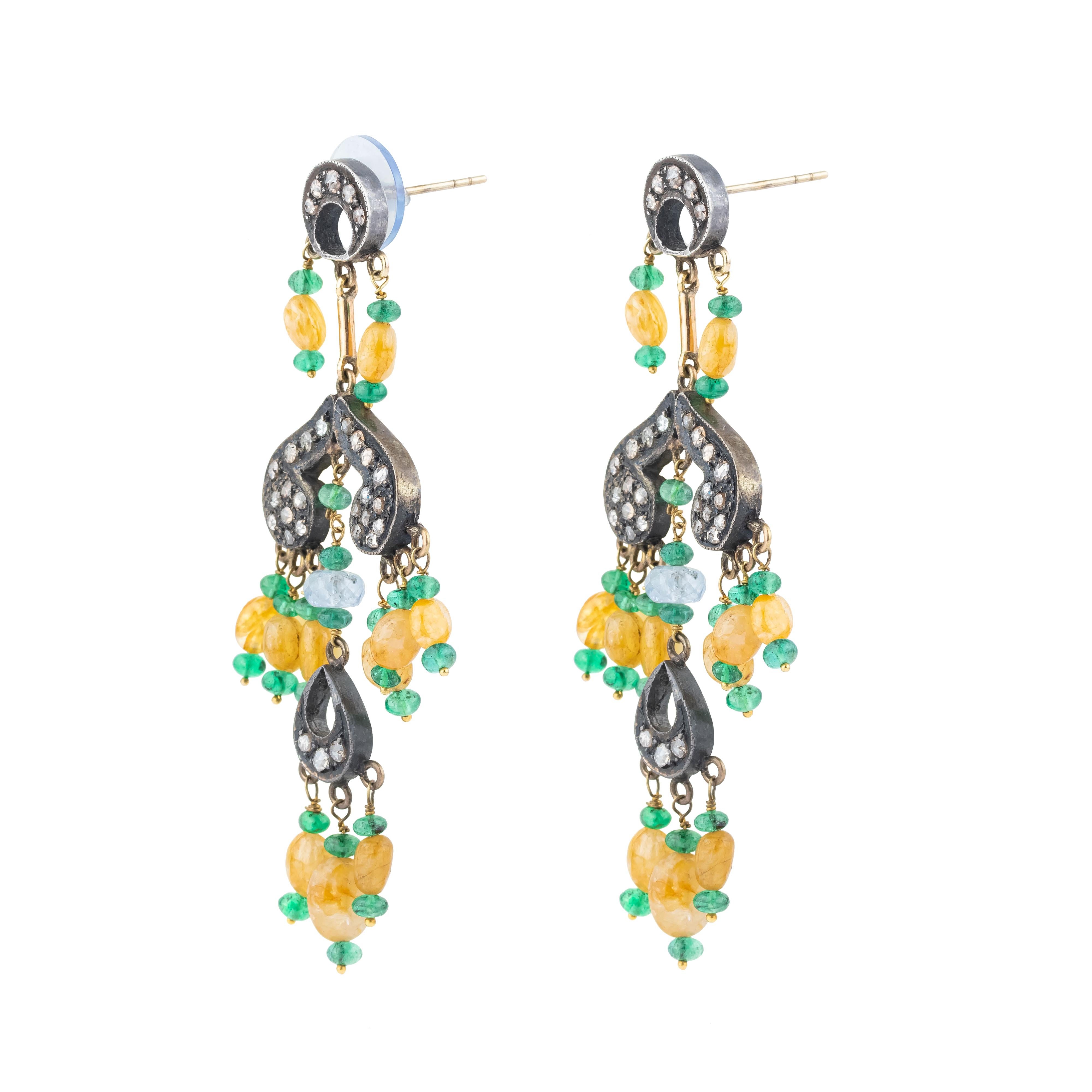 An opulent fusion of elegance and artistry, the 24.45 Carat Diamond and Mixed Stones Chandelier Earrings are a breathtaking display of craftsmanship. Each earring features an exquisite cascade of diamonds, expertly cut to reflect light with