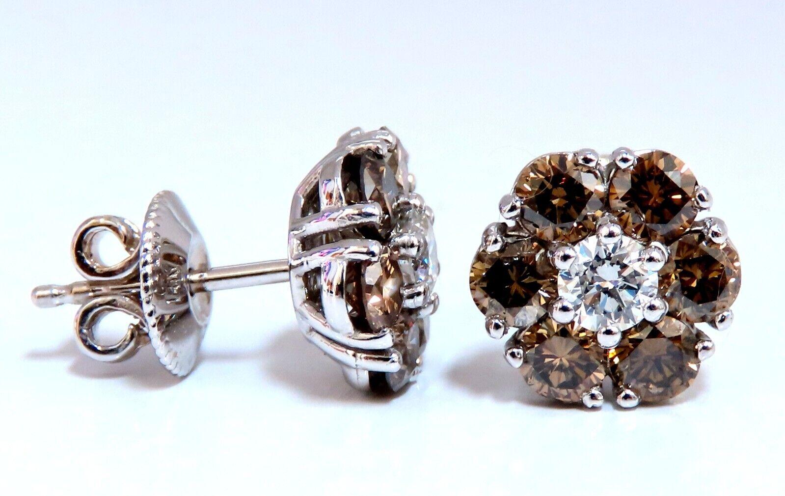 Cluster diamond earrings.

Natural round diamonds

.36ct center (2) diamonds.

G-color Vs-2 clarity

2.44ct side diamond accents.

Natural Fancy Browns -  Si-1 clarity

14 karat white gold 3.5 grams

Earrings measure 10mm wide

$8,000 appraisal