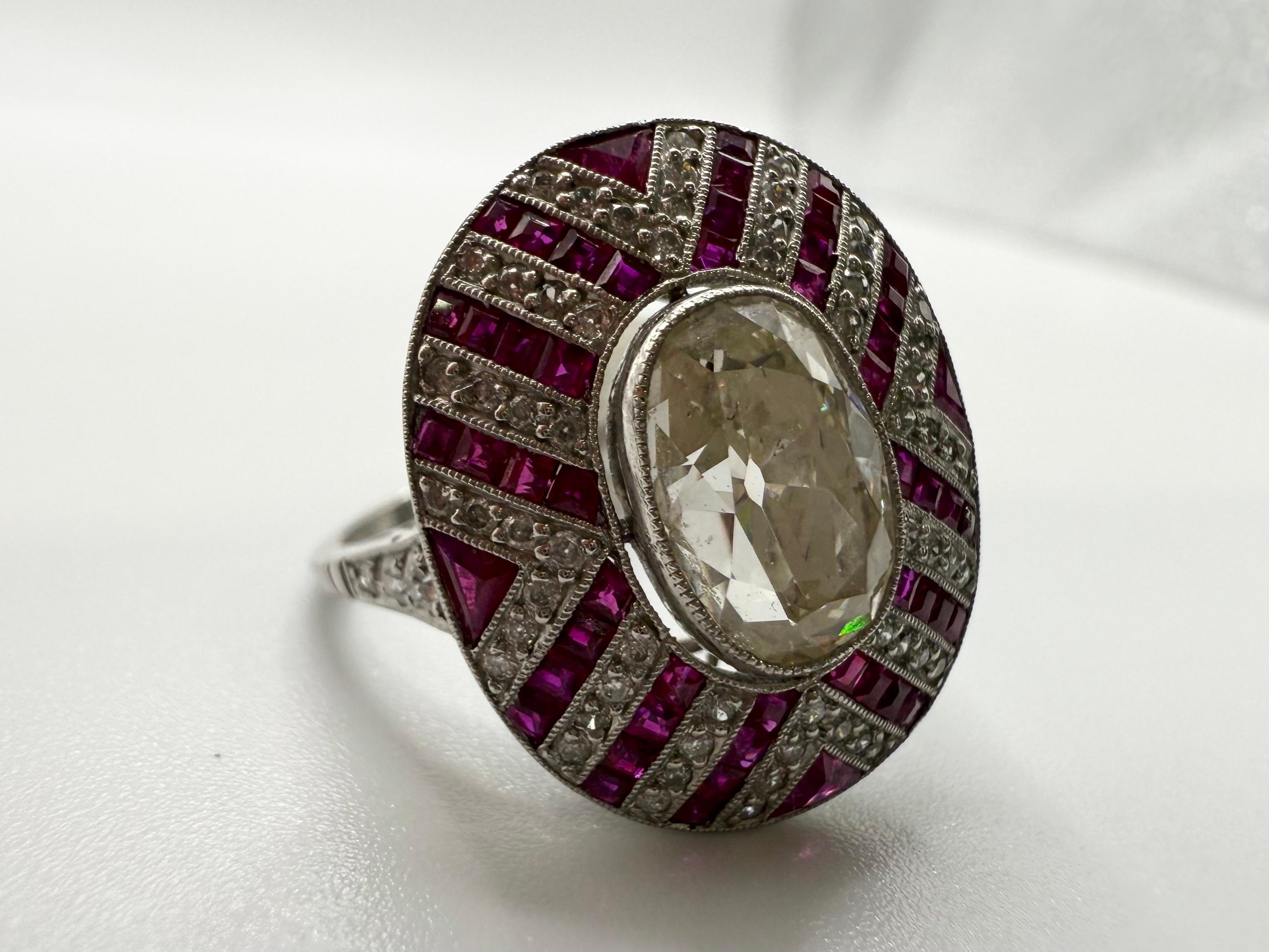 Stunning center totaling 2.44 carats and rubies and small diamonds totaling 0.46 carats, the ring year is unknown, the workmanship is done by hand 100% from a piece of platinum metal, the setting style of diamonds is old. The ring is a piece of art
