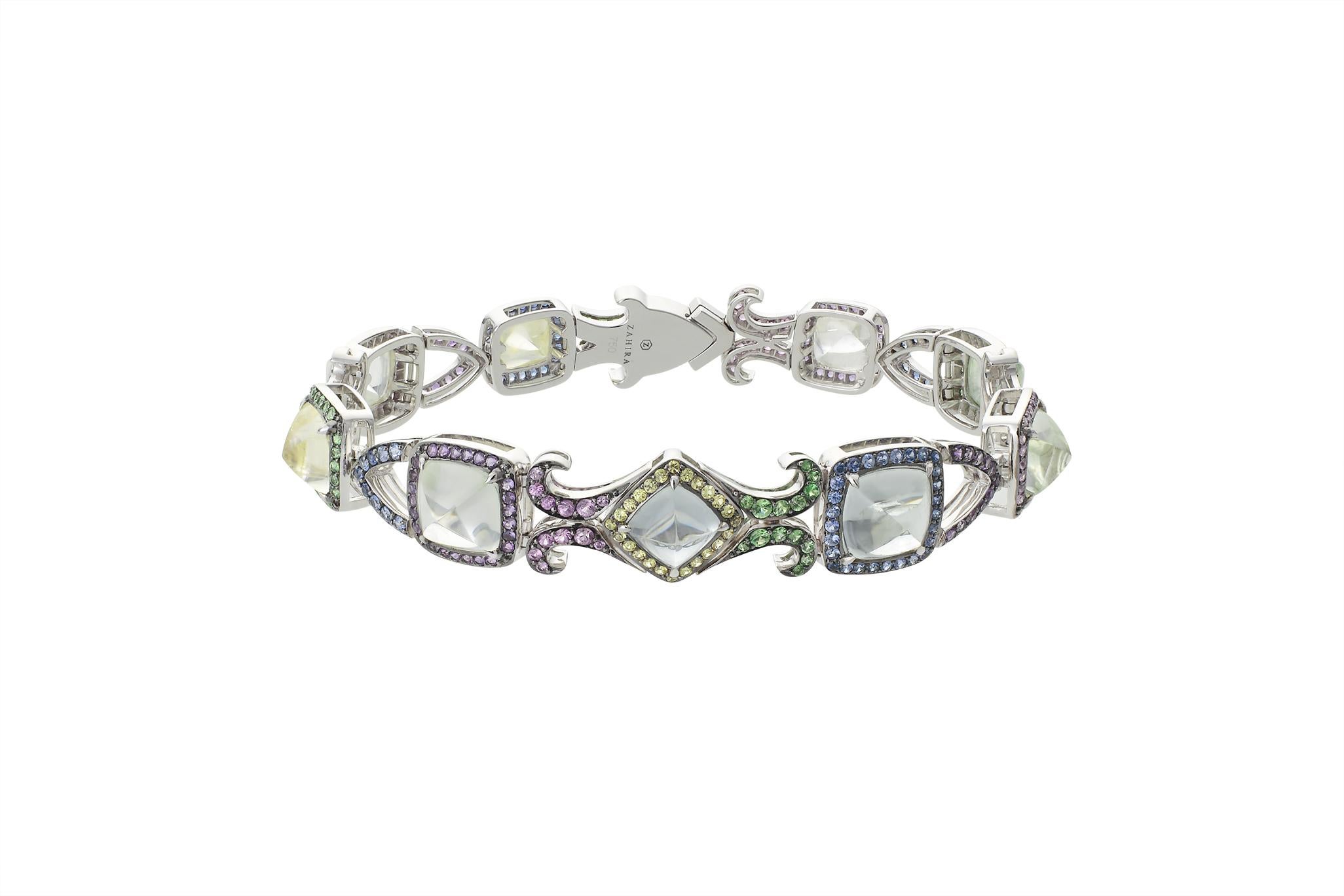 This rare Burmese sugarloaf sapphire bracelet is part of a three piece set. The 24.5cts of fancy sapphires are delicately set with pave'd coloured sapphires, tsavorite and amethyst in our signature colour change technique. Feminine and intricate,