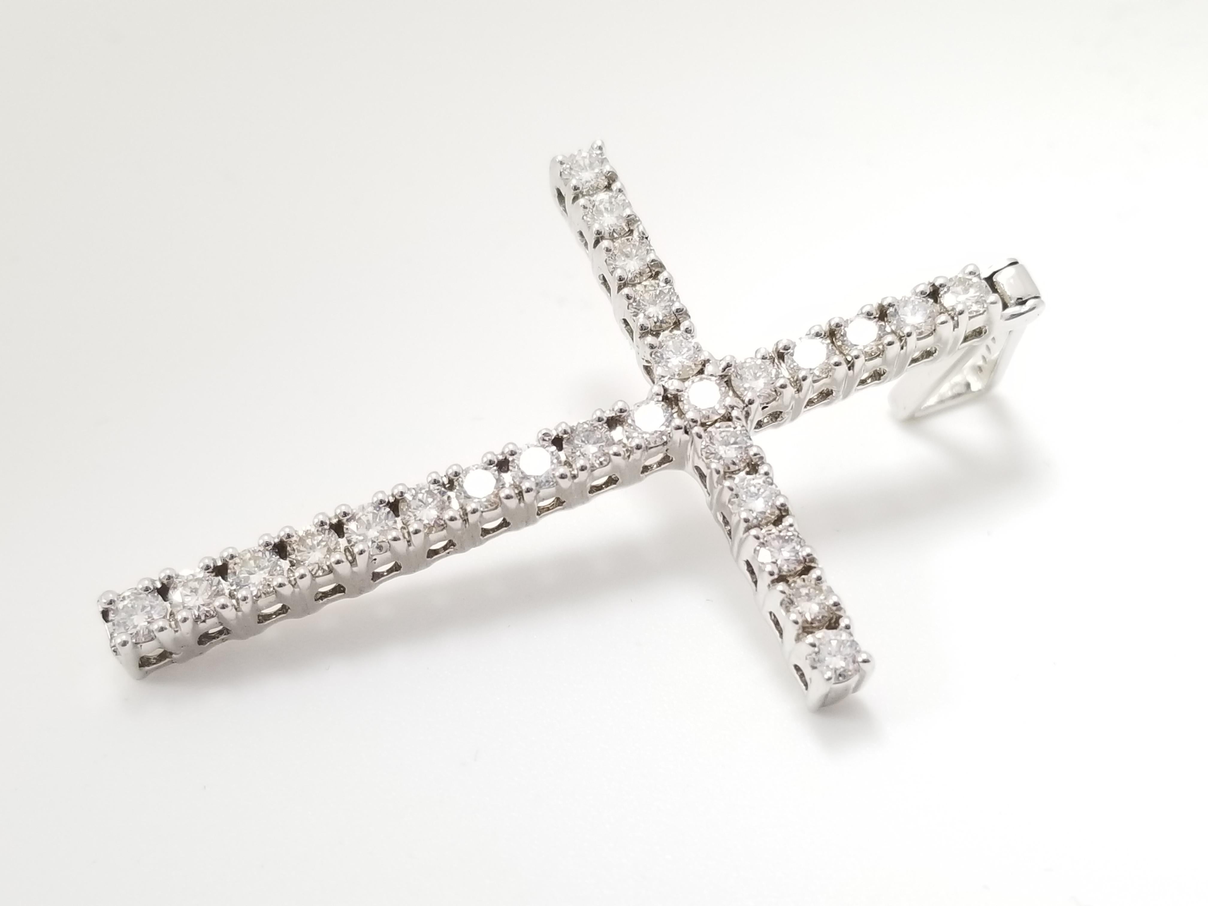 Beautiful and Bold Natural Diamond Cross Pendant White Gold 14K. A total weight of 2.45 cttw natural round cut diamonds very sparkly and shiny look.
Measurements: 2.5 inch Length x 1.25 inch Width
Average Color/Clarity: H-VS