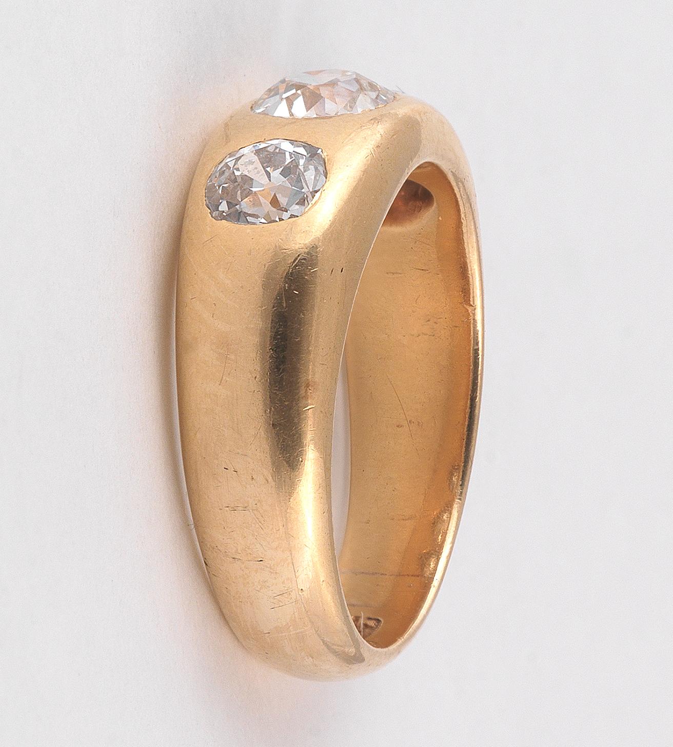 The gypsy-set cushion-cut diamond weighing approximately 1.15 carats, which is flanked on each side with a 0.65 carat old European cut diamond.
Size 9 1/2
Weight: 12,7gr.