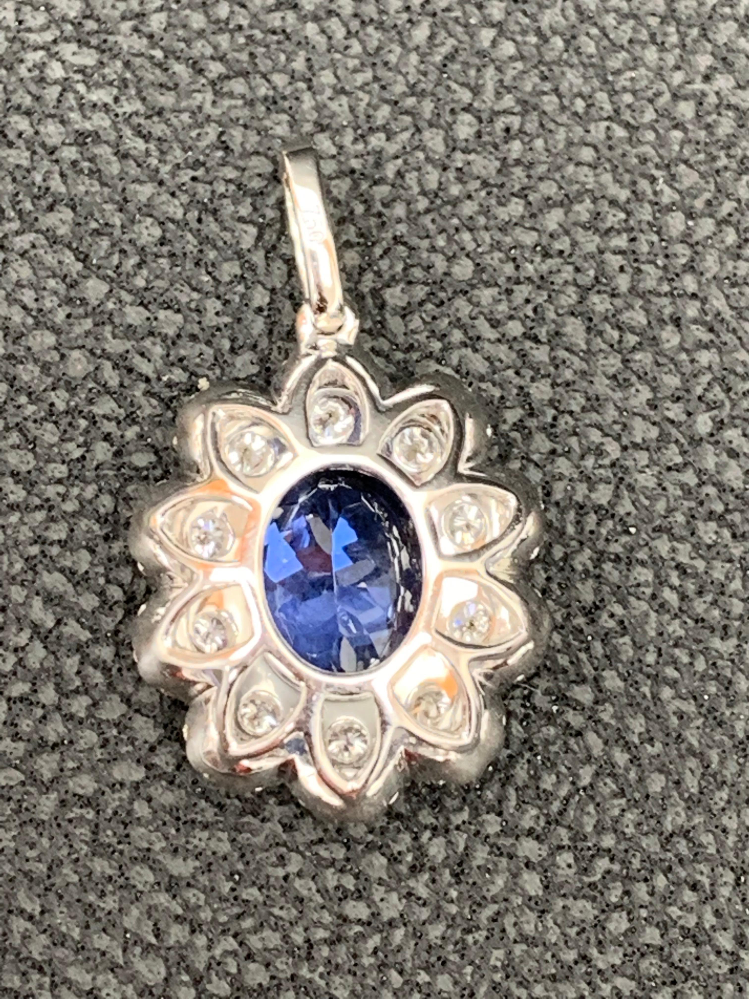 Modern 2.45 Carat Oval Cut Tanzanite and Diamond Halo Flower Pendant Necklace For Sale