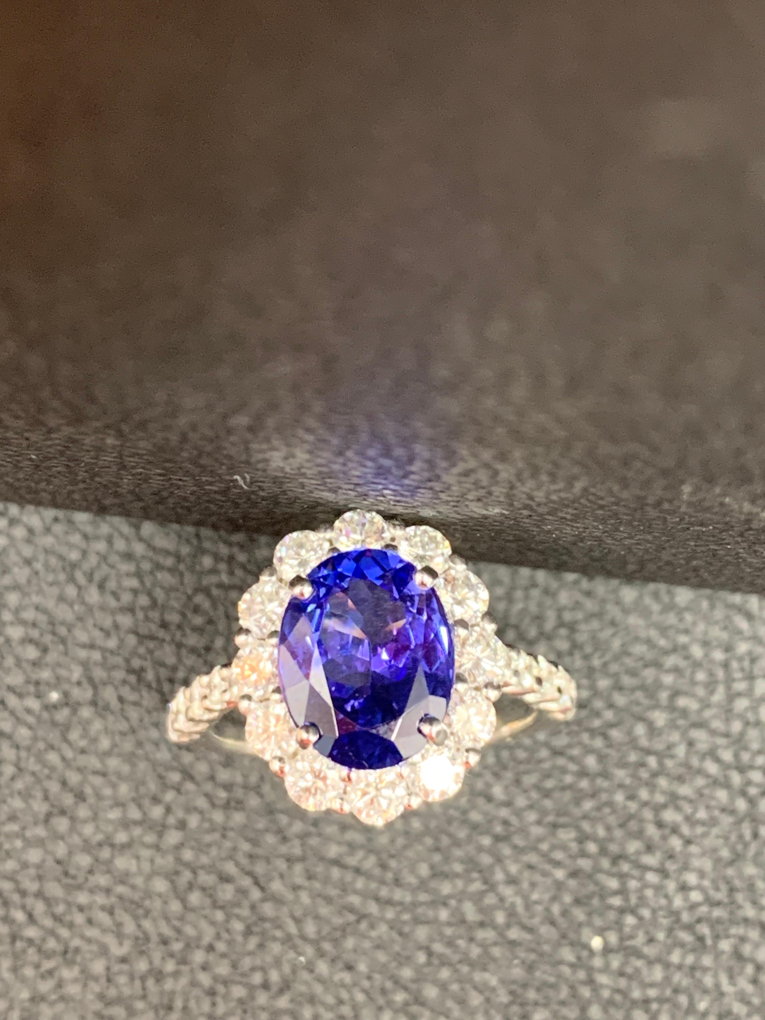2.45 Carat Oval Cut Tanzanite and Diamond Halo Flower Ring in 18K White Gold For Sale 2