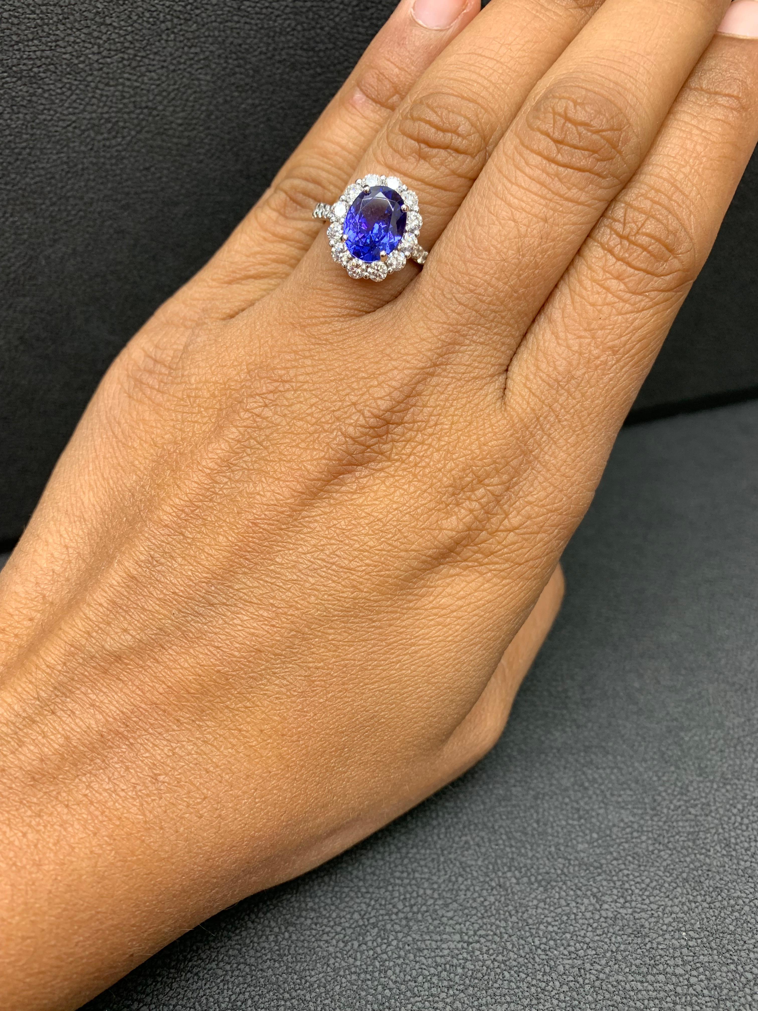 2.45 Carat Oval Cut Tanzanite and Diamond Halo Flower Ring in 18K White Gold For Sale 4