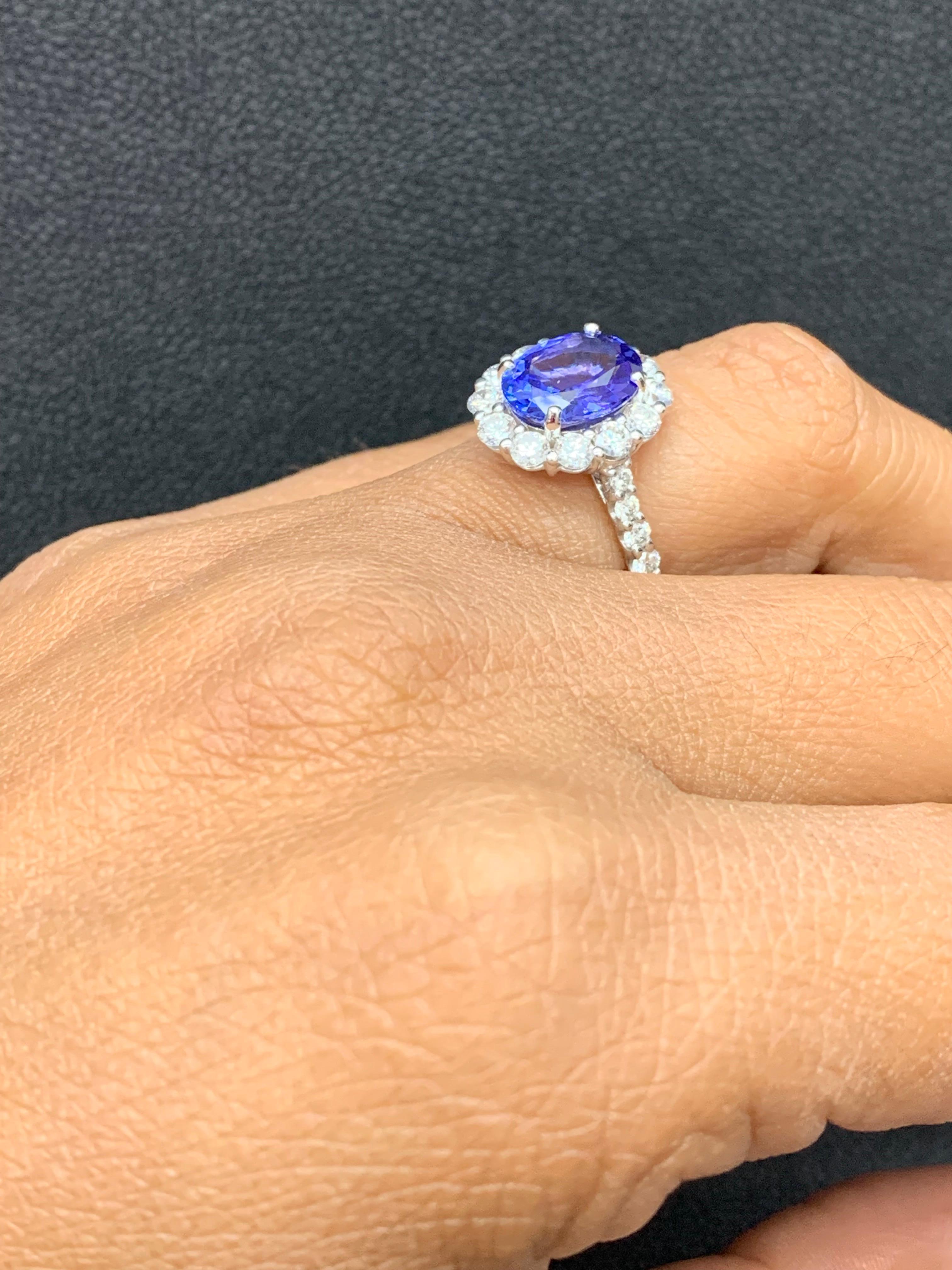 2.45 Carat Oval Cut Tanzanite and Diamond Halo Flower Ring in 18K White Gold For Sale 5